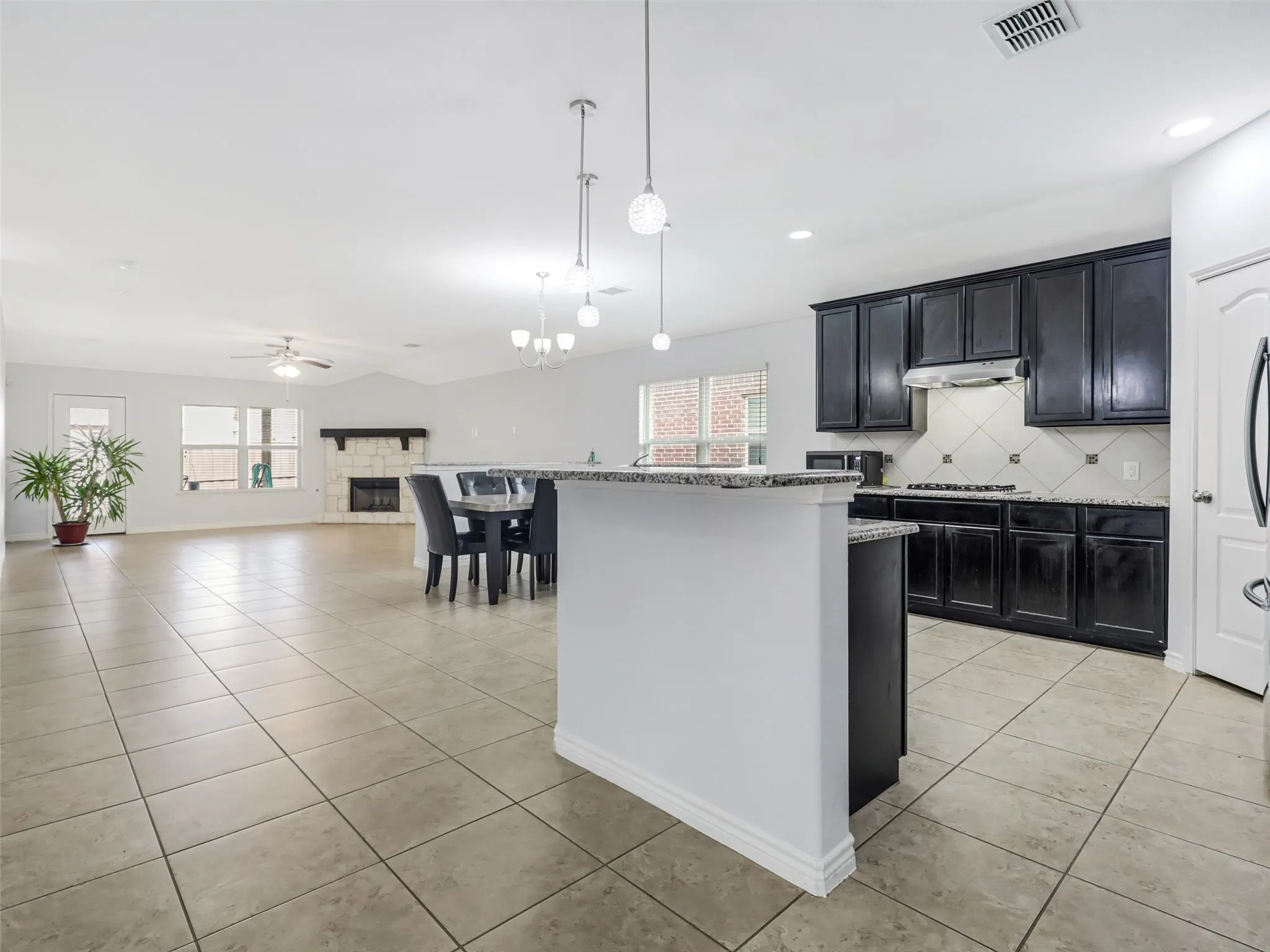 Open-concept interior featuring tile flooring