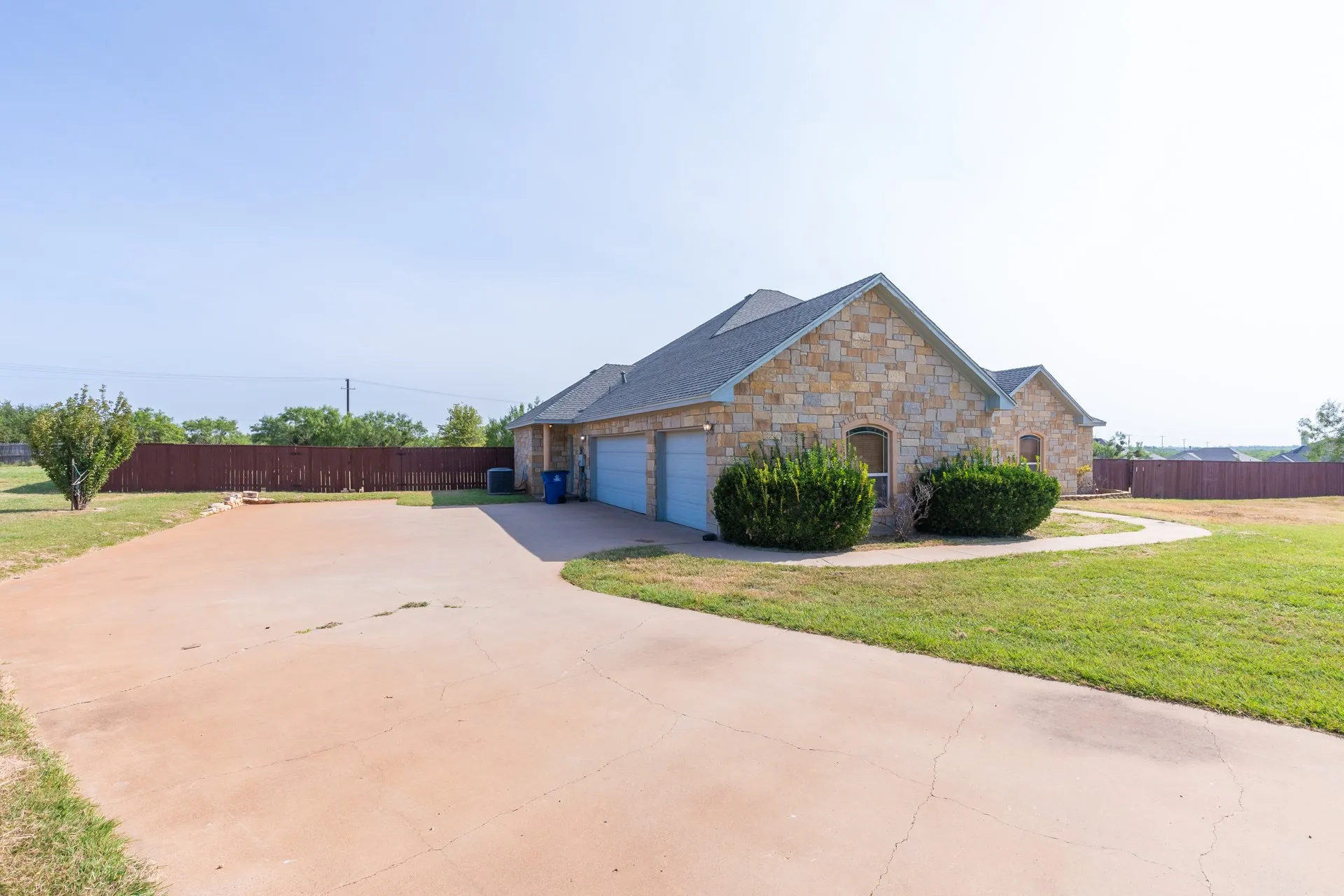 Stone veneer exterior with a two-car garage