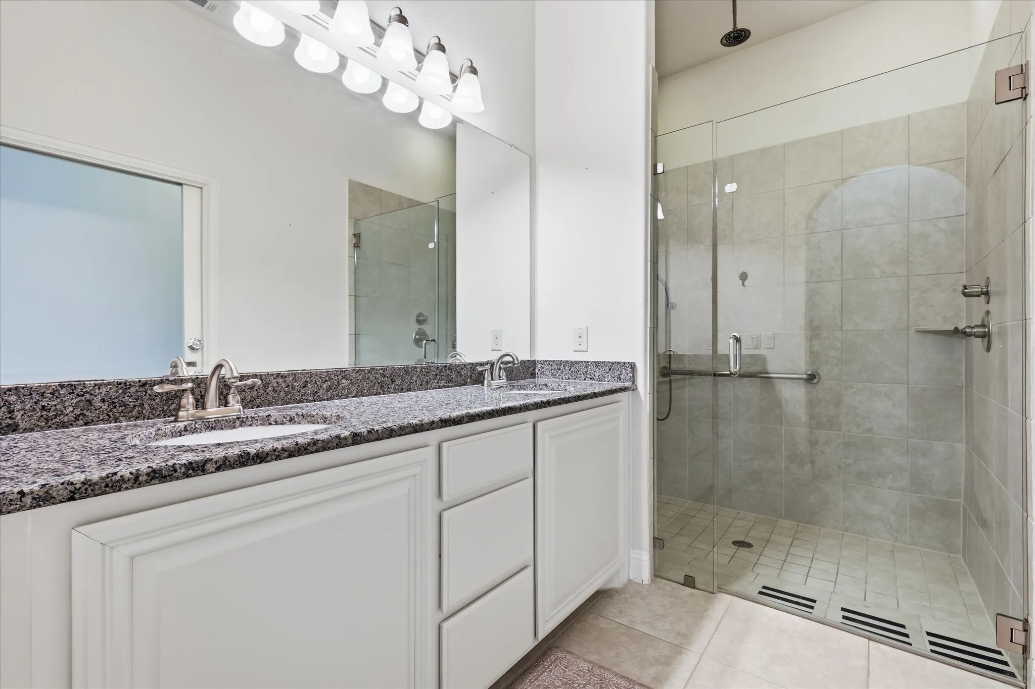 Hall bathroom with walk-in shower.