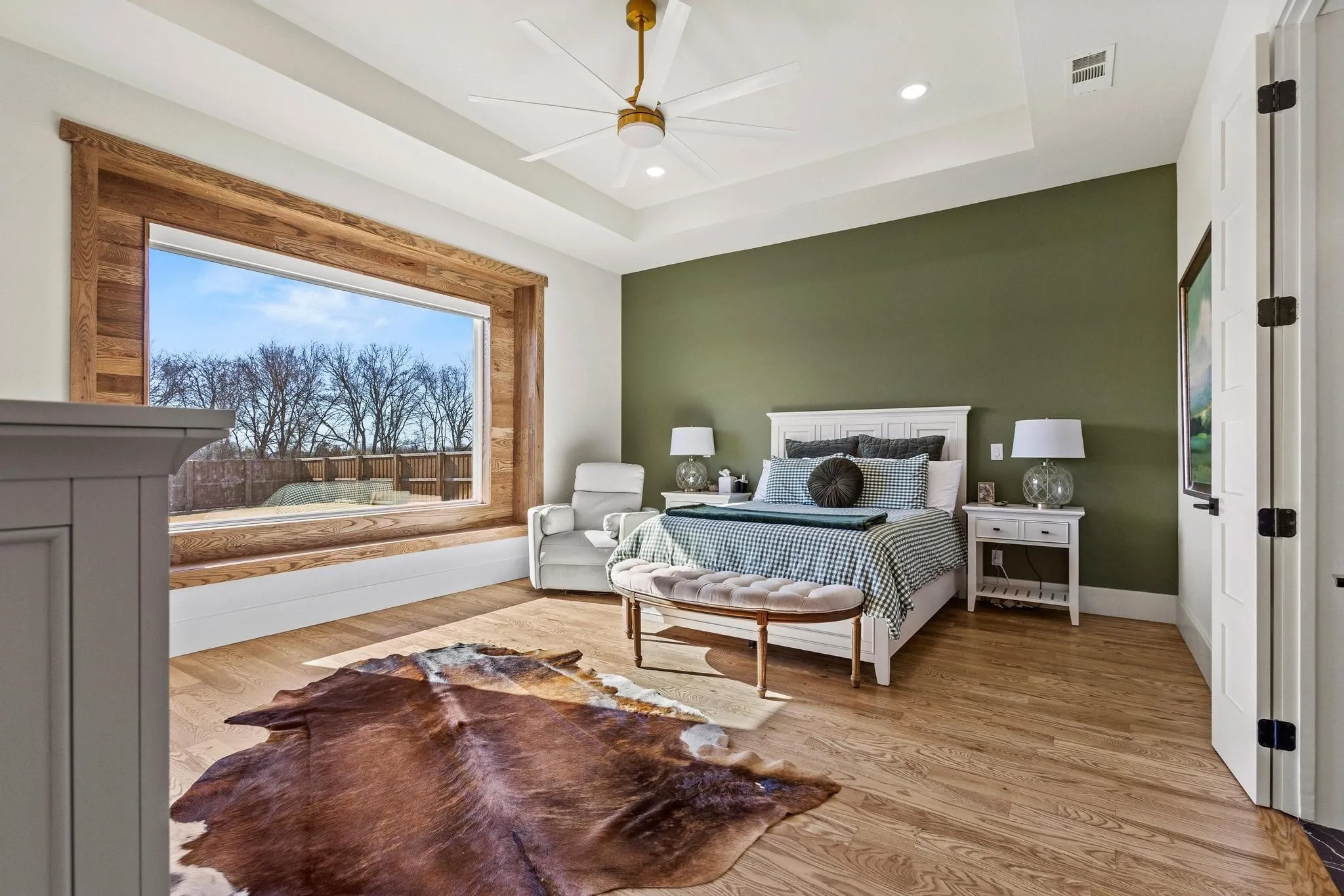 Expansive picture window framed with wood-finish trim