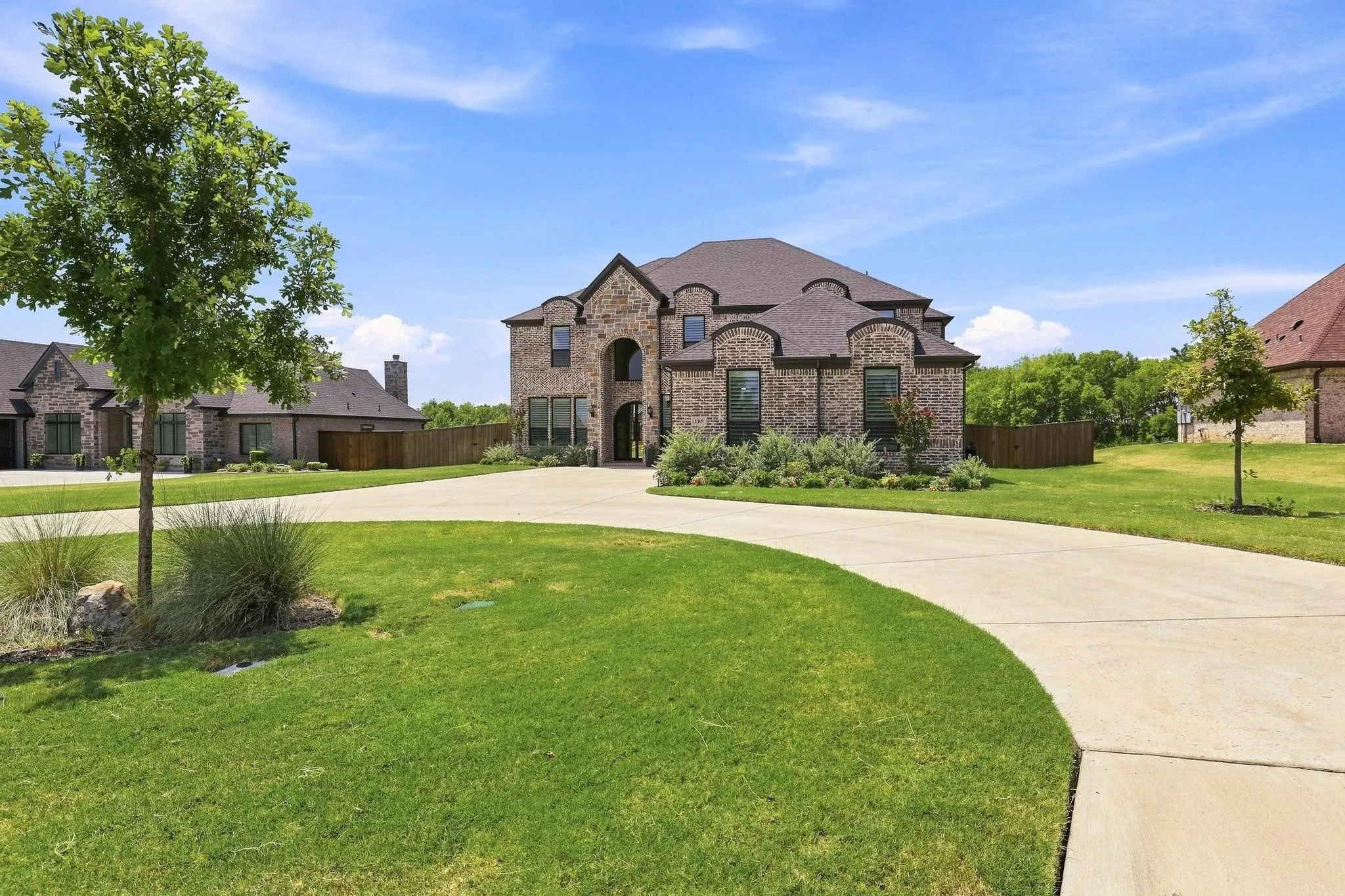 Brick and stone veneer exterior with arched entry