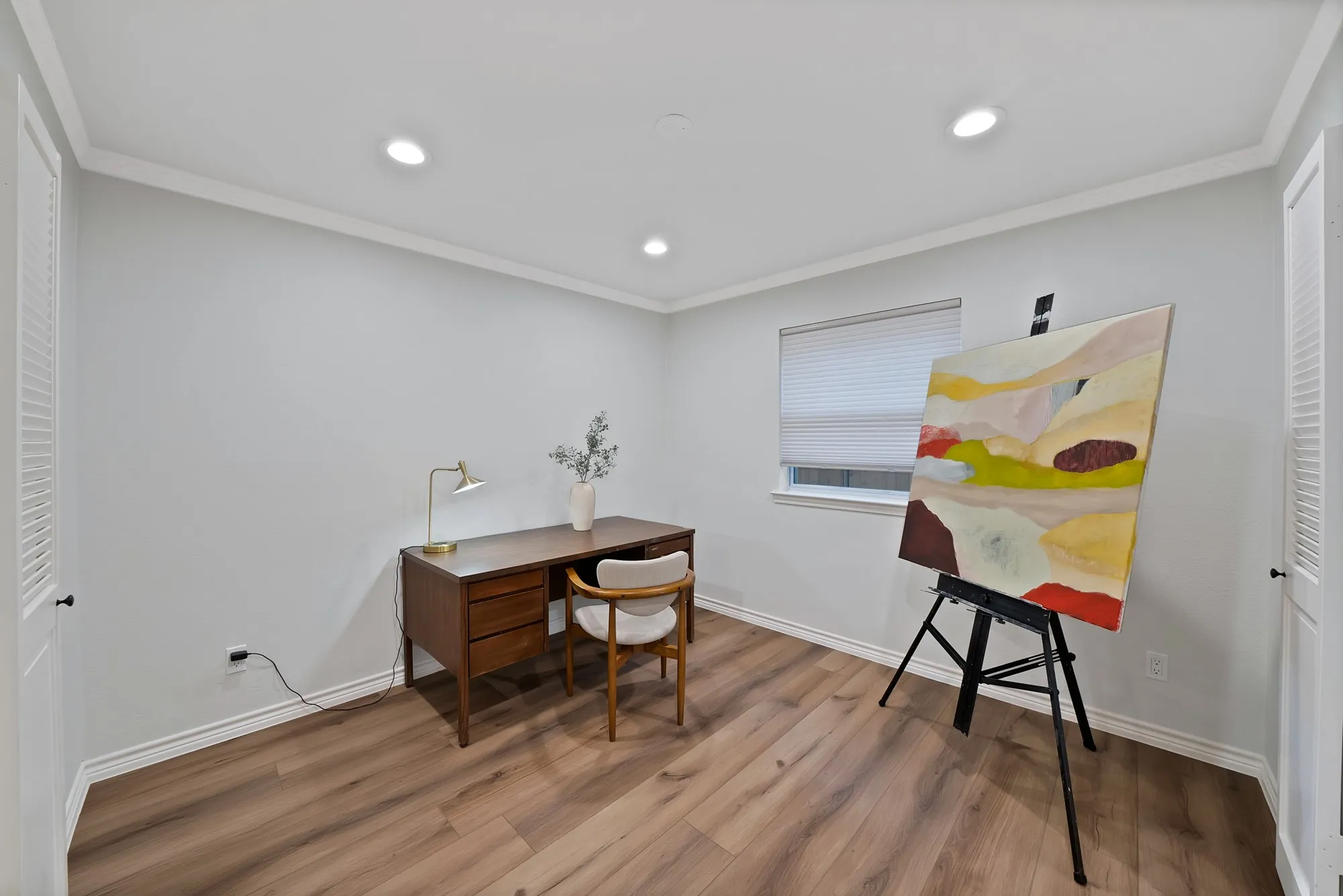 Recessed lighting, crown molding, wood-finish flooring, and a window with blinds
