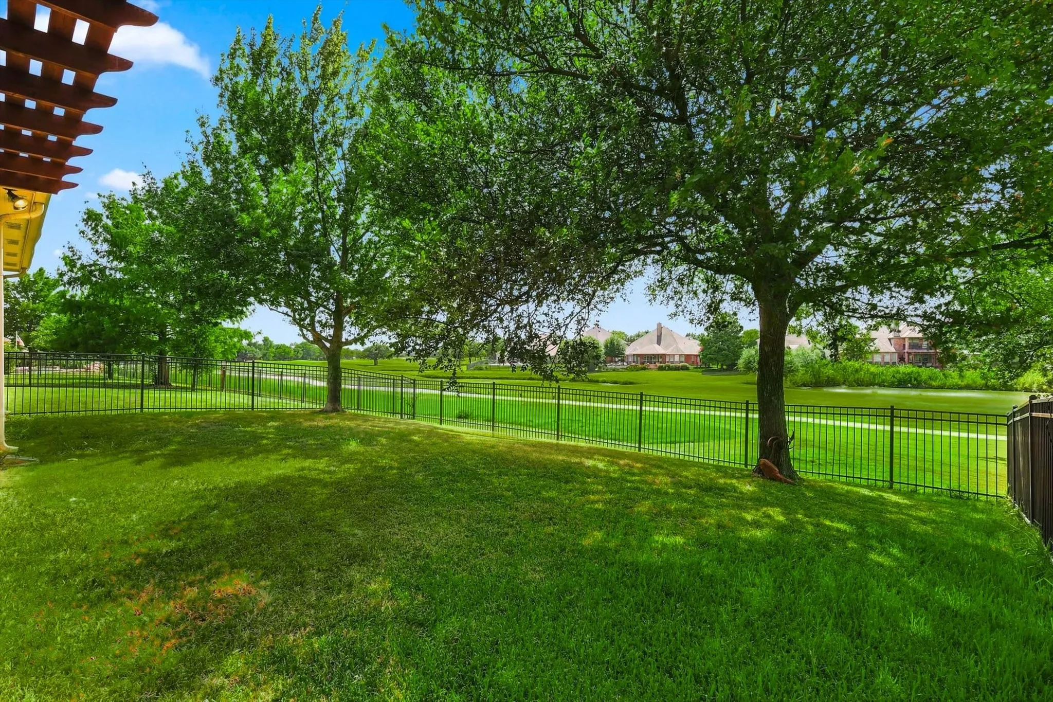 The spacious backyard affords picturesque golf course views.