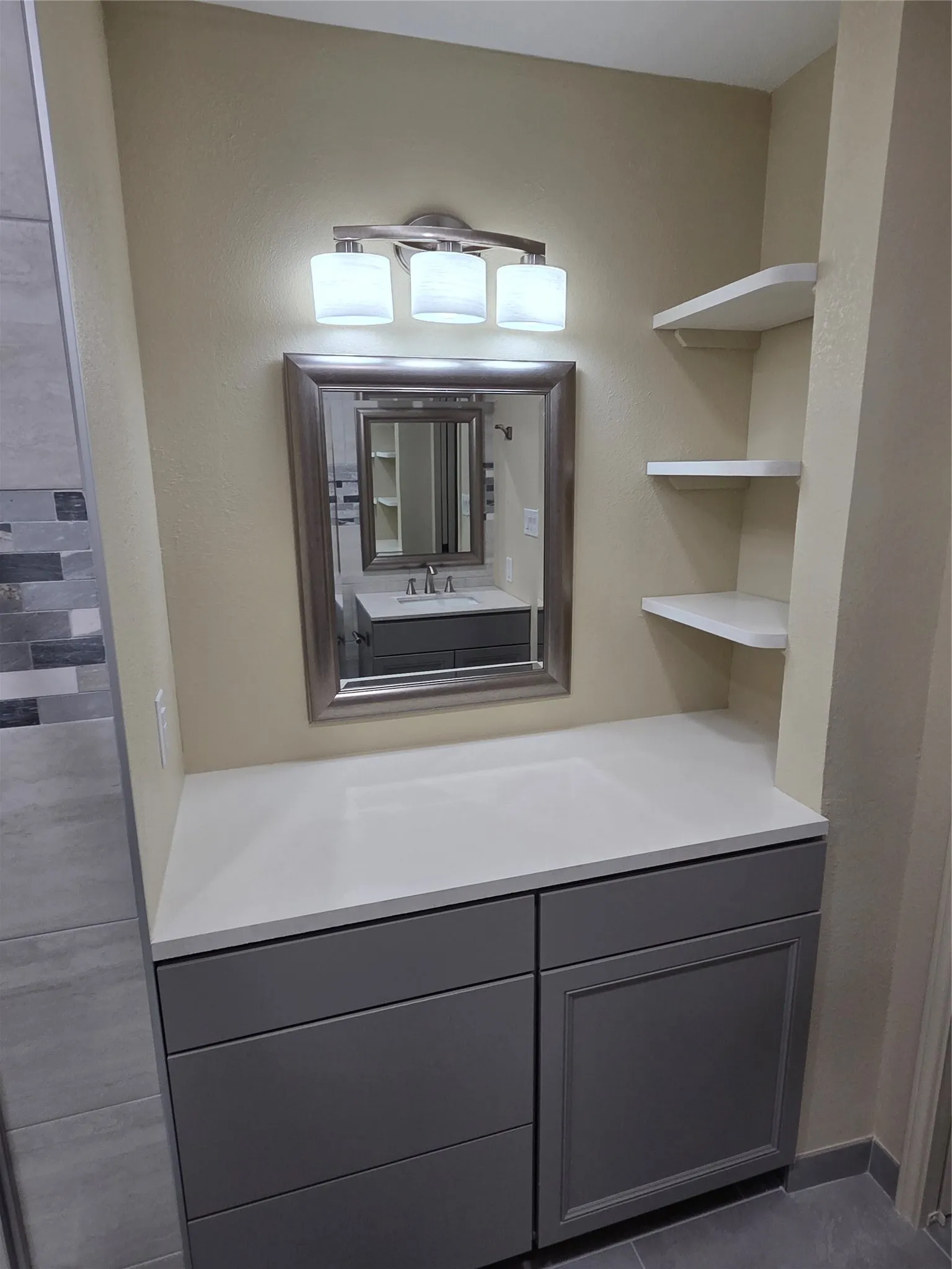 Newly remodeled bathroom.  Vanity area with additional storage