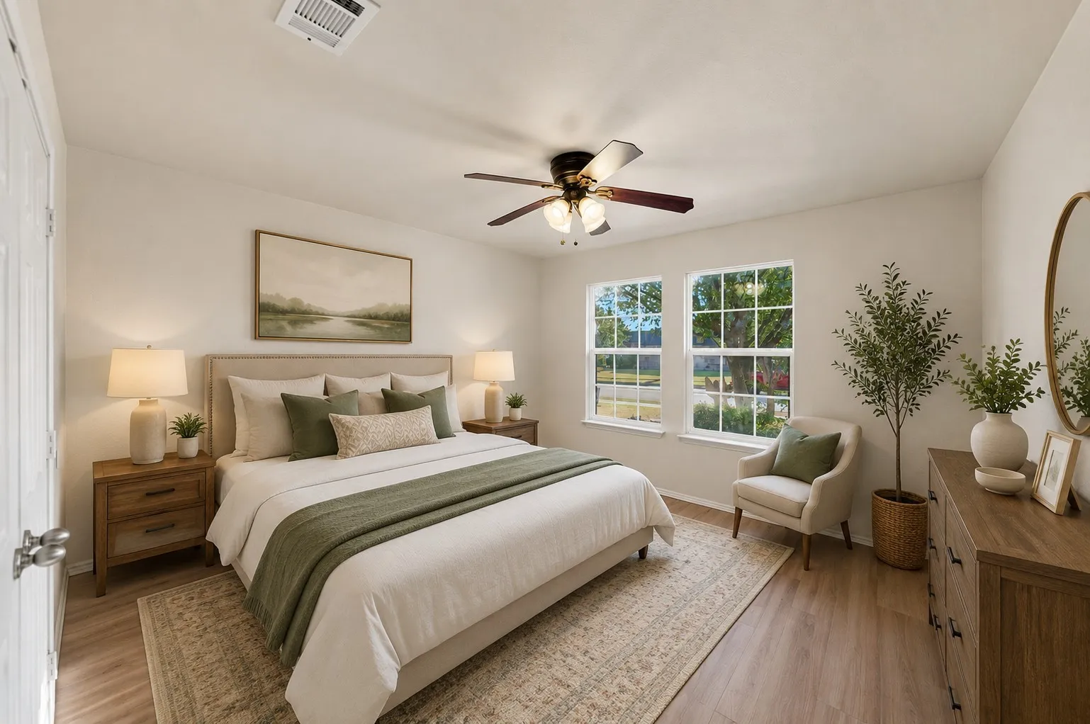 Virtually Staged -Primary bedroom featuring wood-finish flooring, a ceiling fan, and two large windows