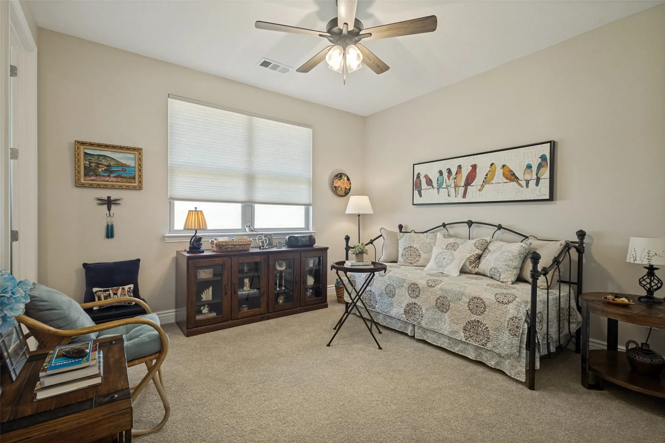 A WONDERFUL SPACE FOR GUESTS WITH ENSUITE BATH. CEILING FAN AND CUSTOM SHADES TOO.