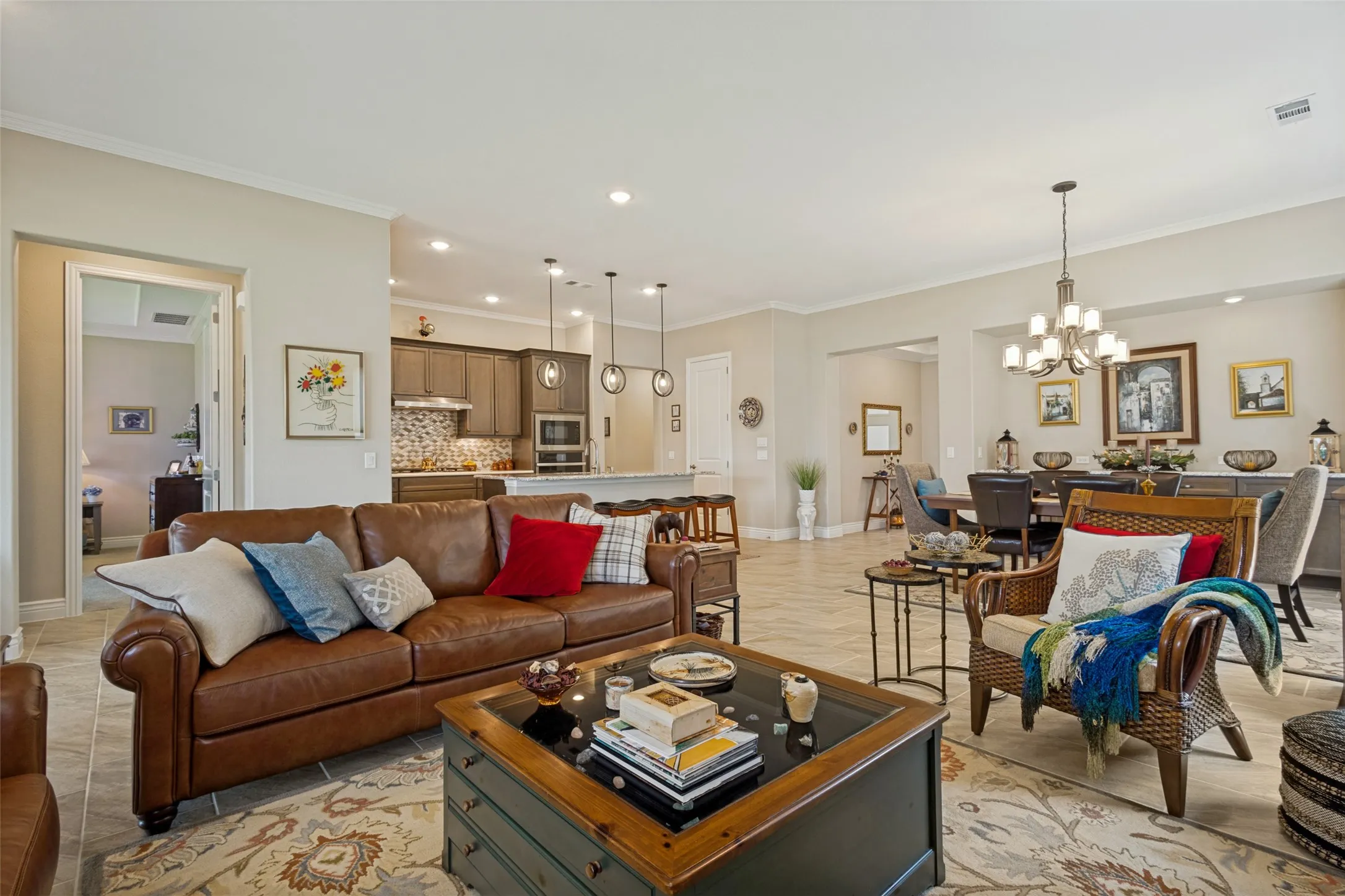 LIVING ROOM SHOWS RELATIONSHIP TO KITCHEN, DINING, ENTRY WAY TO PRIMARY BEDROOM AND FRONT ENTRY.
