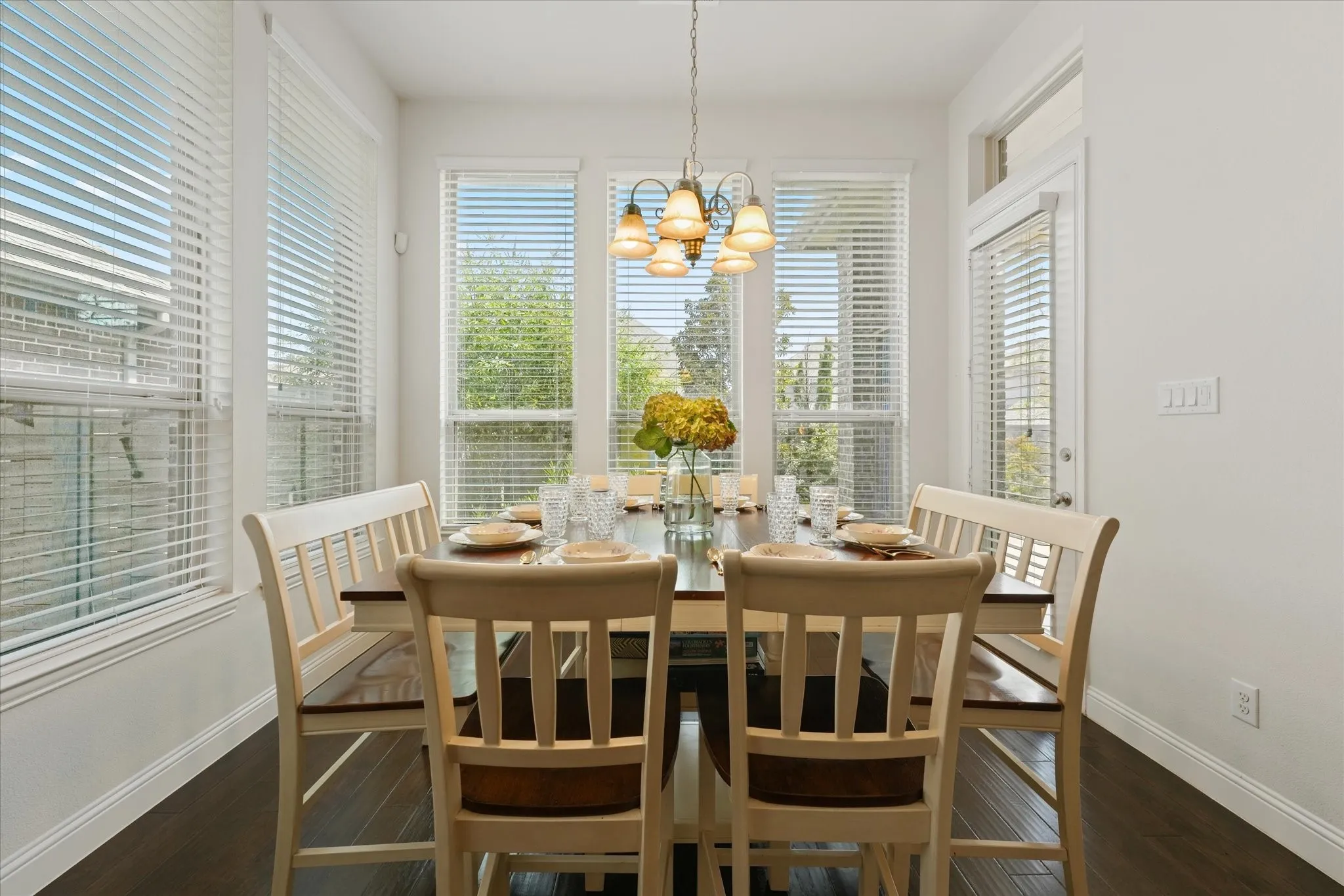 Bright breakfast area with multiple windows, backyard views and direct access to the covered patio in this Harvest by Hillwood home.