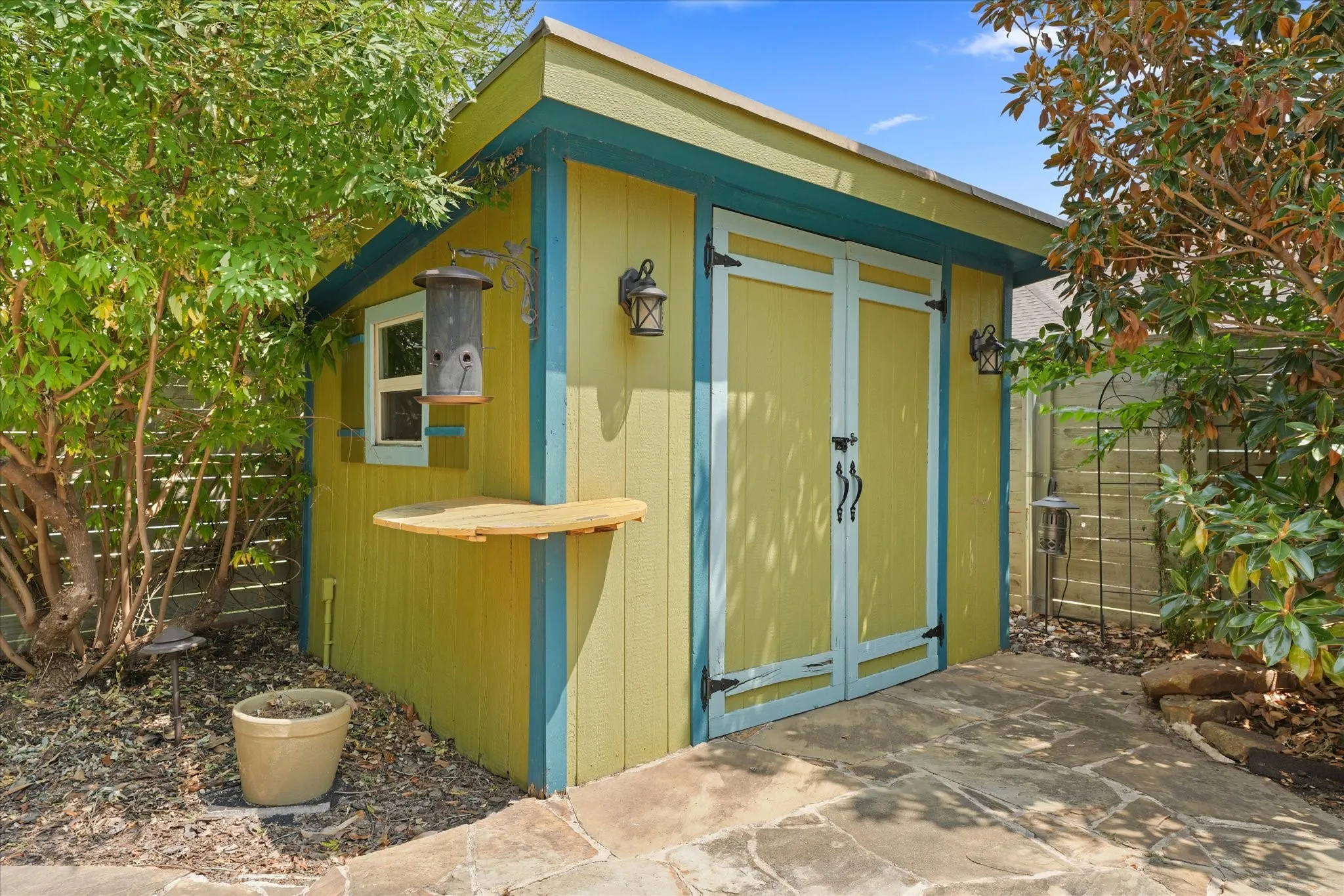 Detached storage building with electricity, workshop space and additional storage for tools, hobbies or lawn equipment.
