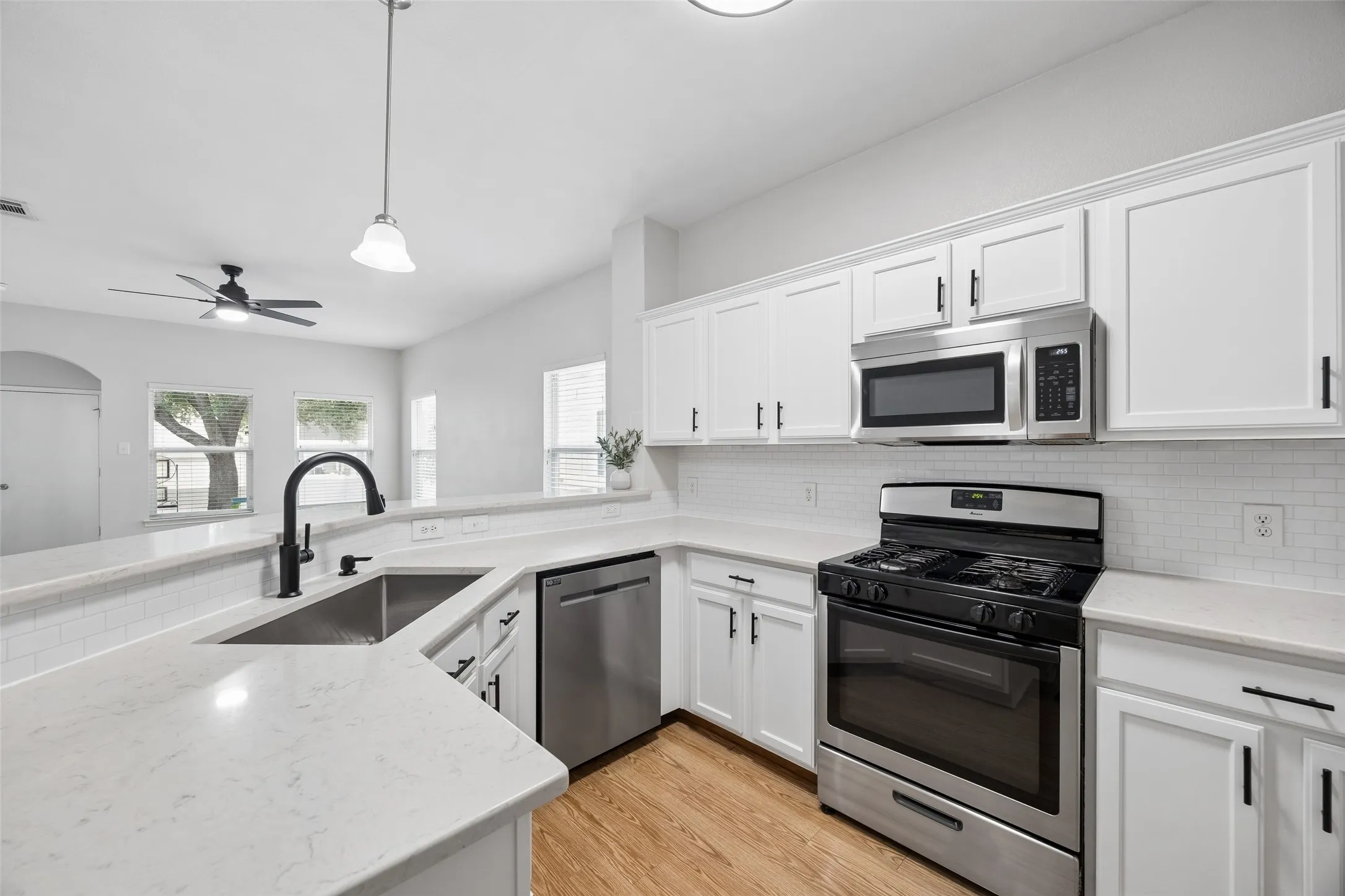 Gas range and quartz counters.
