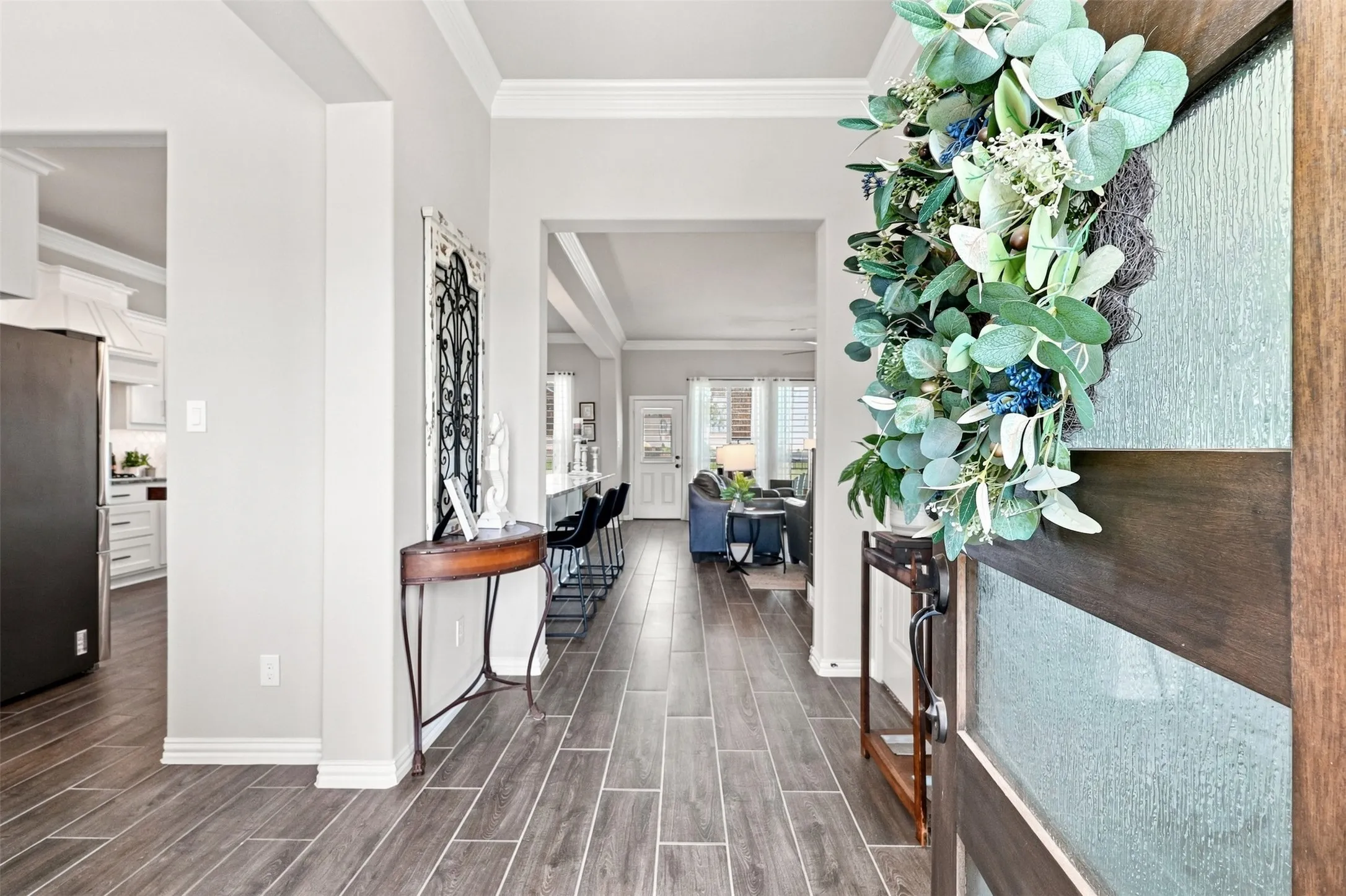 Wood-finish tile flooring throughout the entryway
