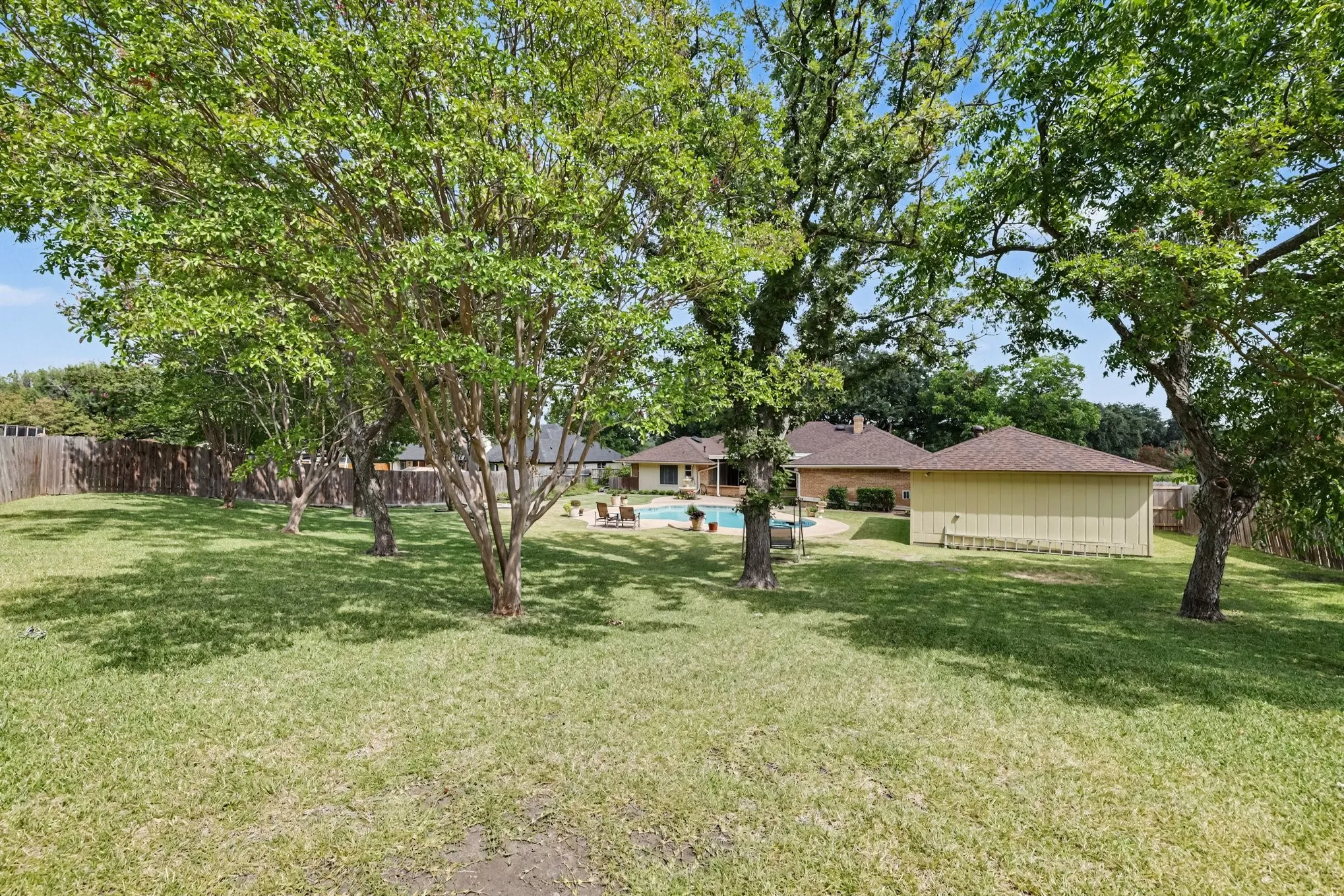 Side-entry garage with extra parking pad
