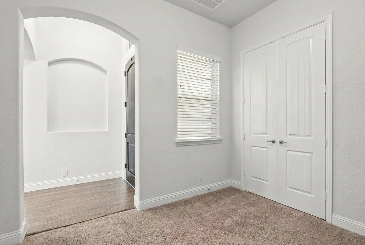 Office or flex space near the entrance of the home. Note the closet.