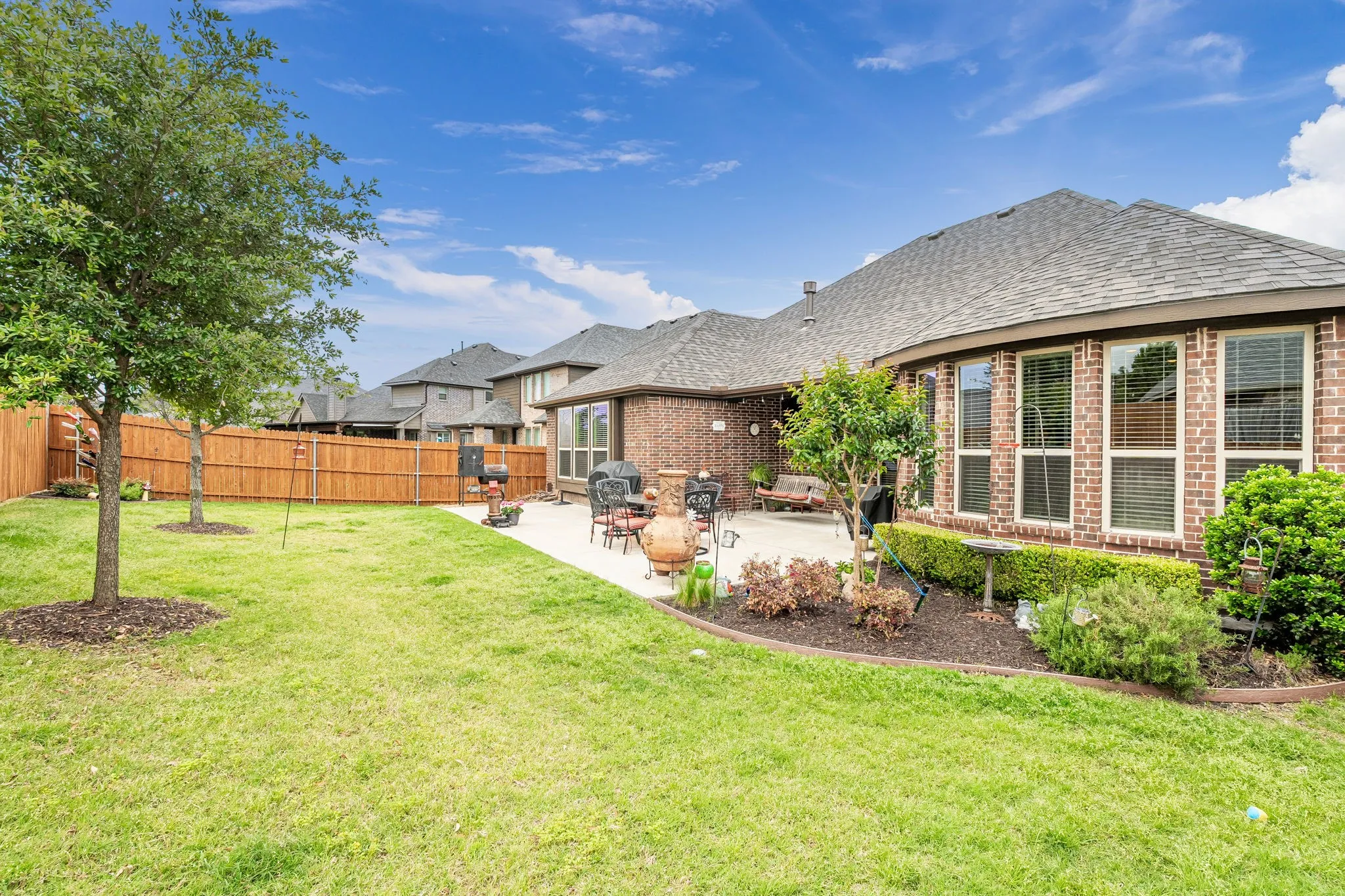 Covered porch with extended patio. Great for entertaining or relaxing with a cup of coffee.