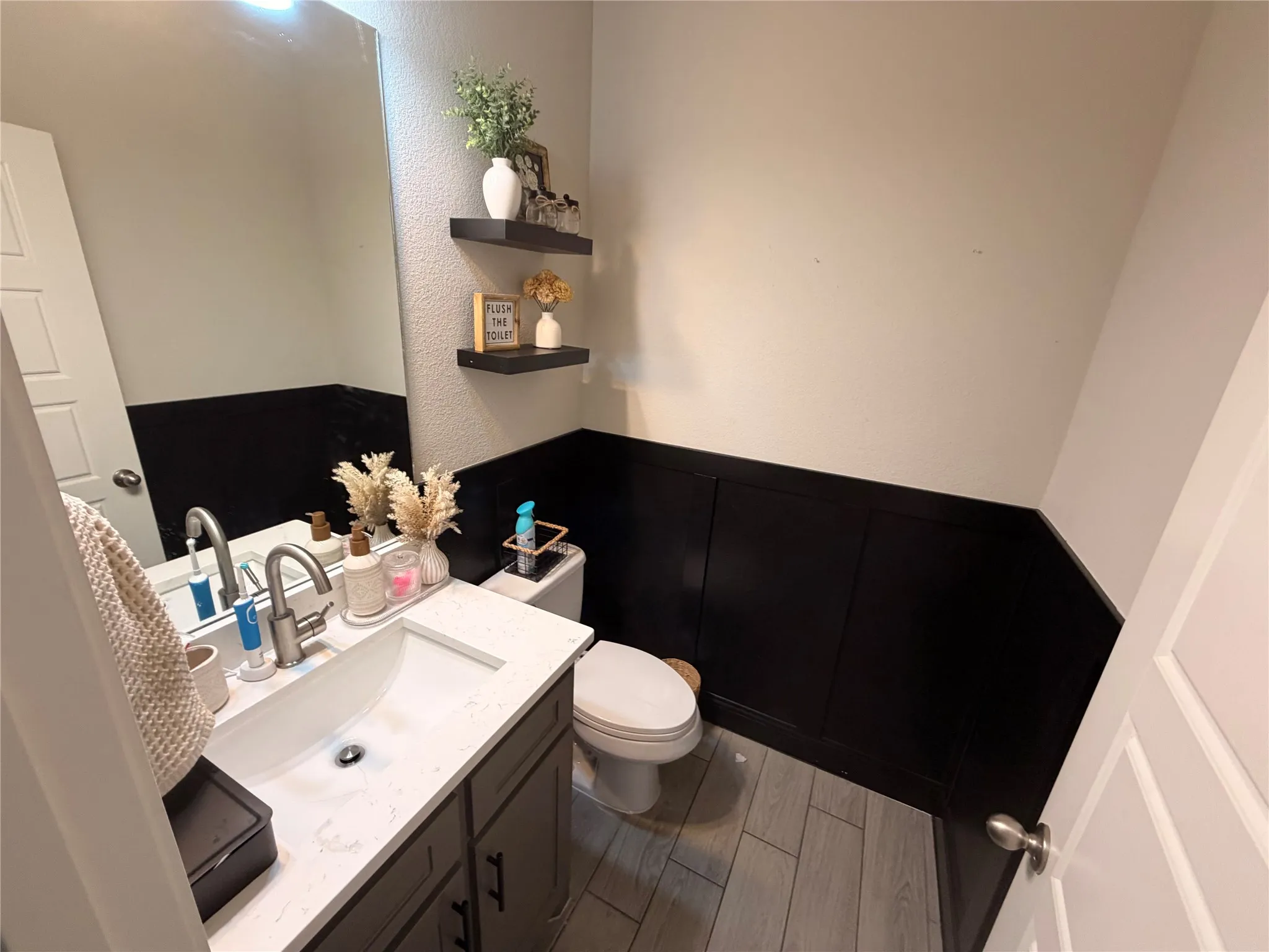 half bathroom located in hallway