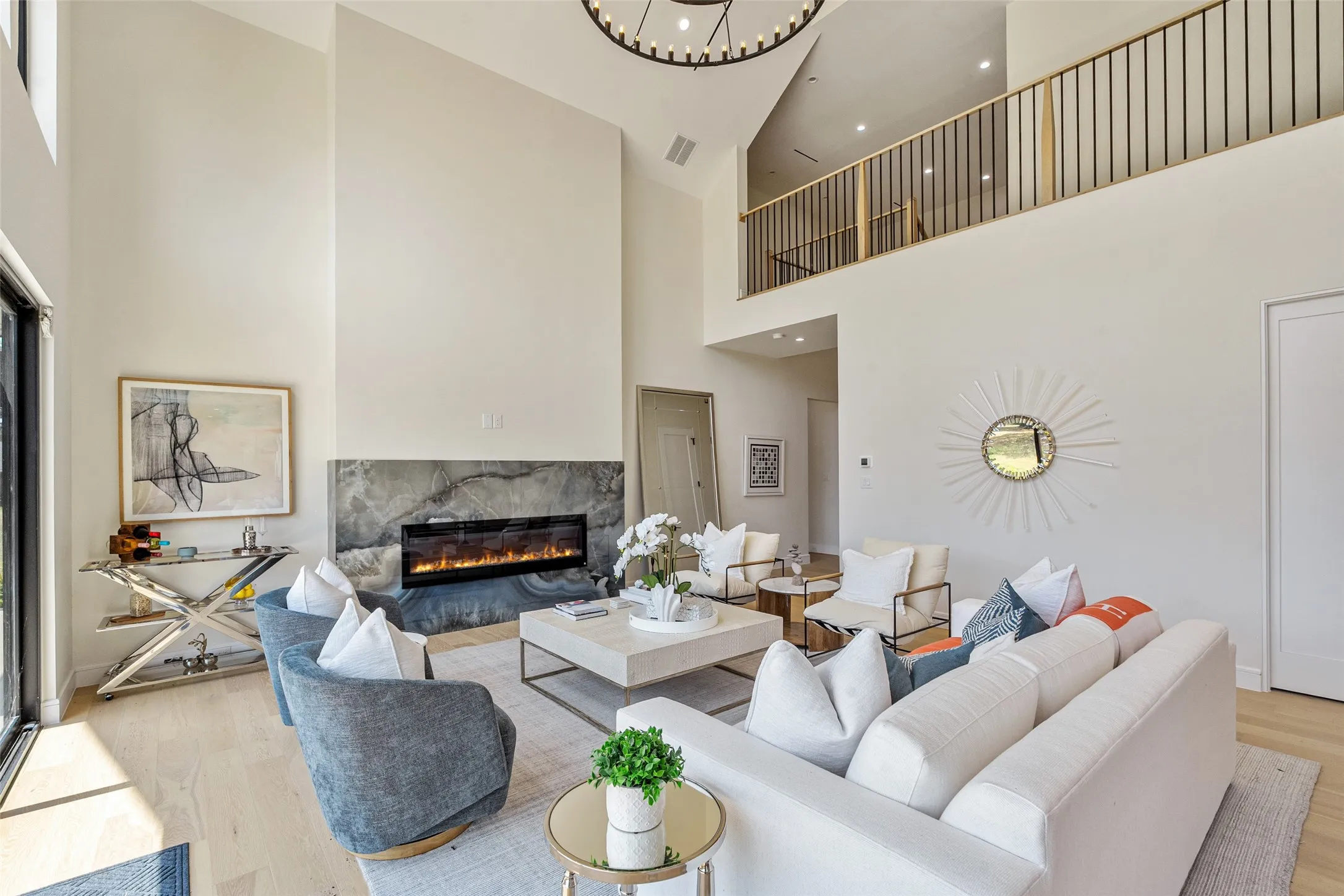Vaulted ceilings and light wood-finish flooring