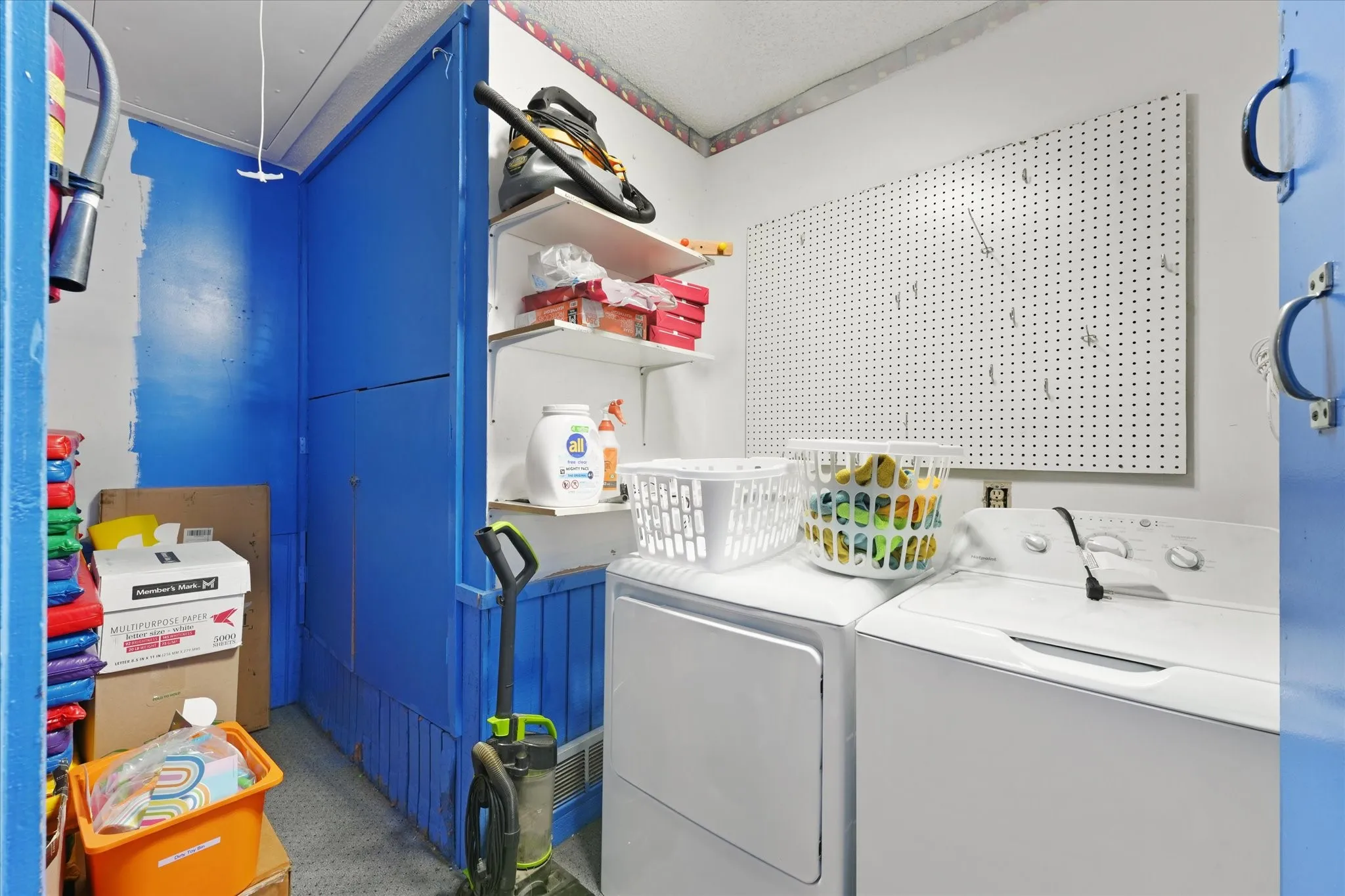 Dedicated laundry area featuring a washer and dryer