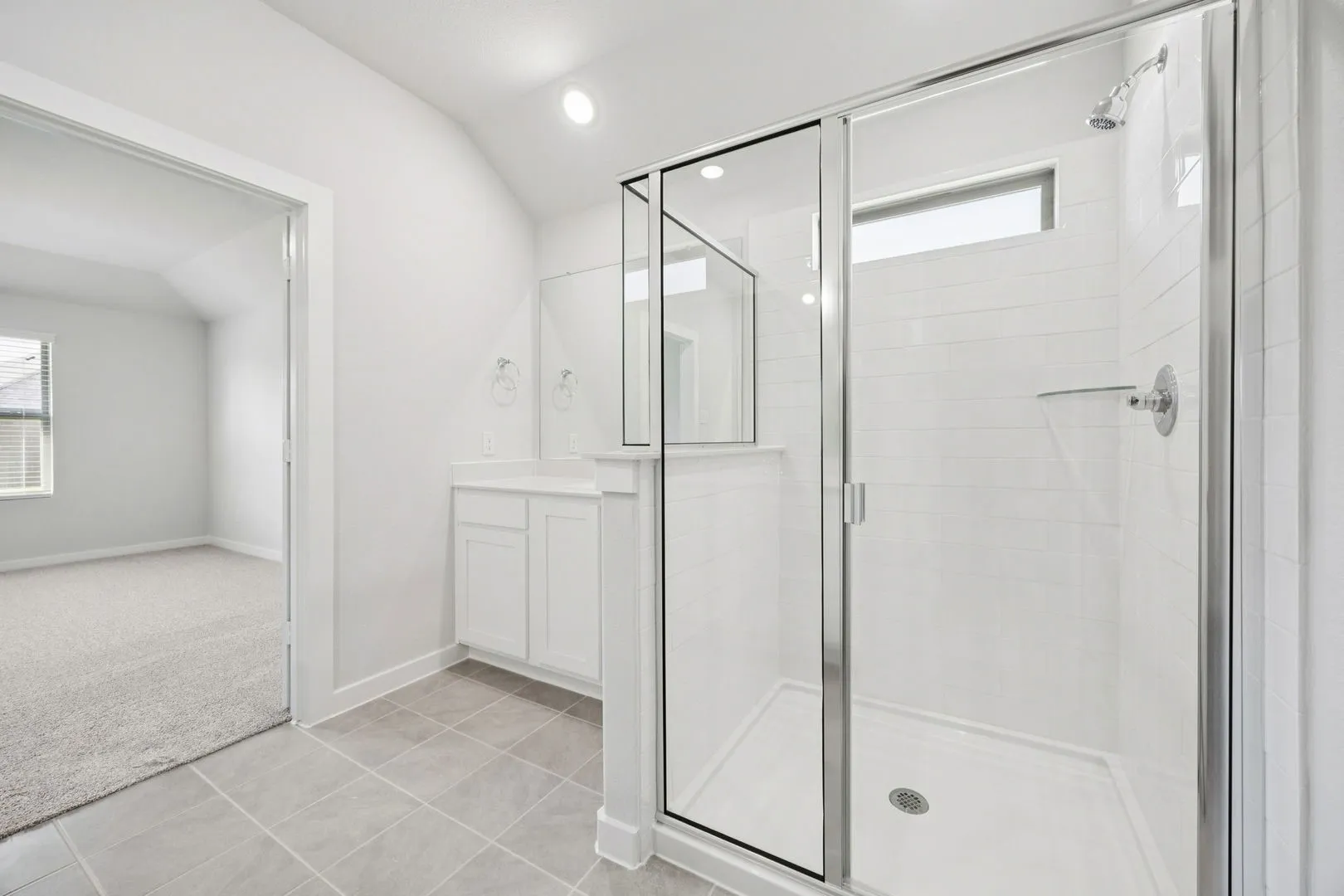 Primary Bathroom in the Heisman home plan by Trophy Signature Homes – REPRESENTATIVE PHOTO