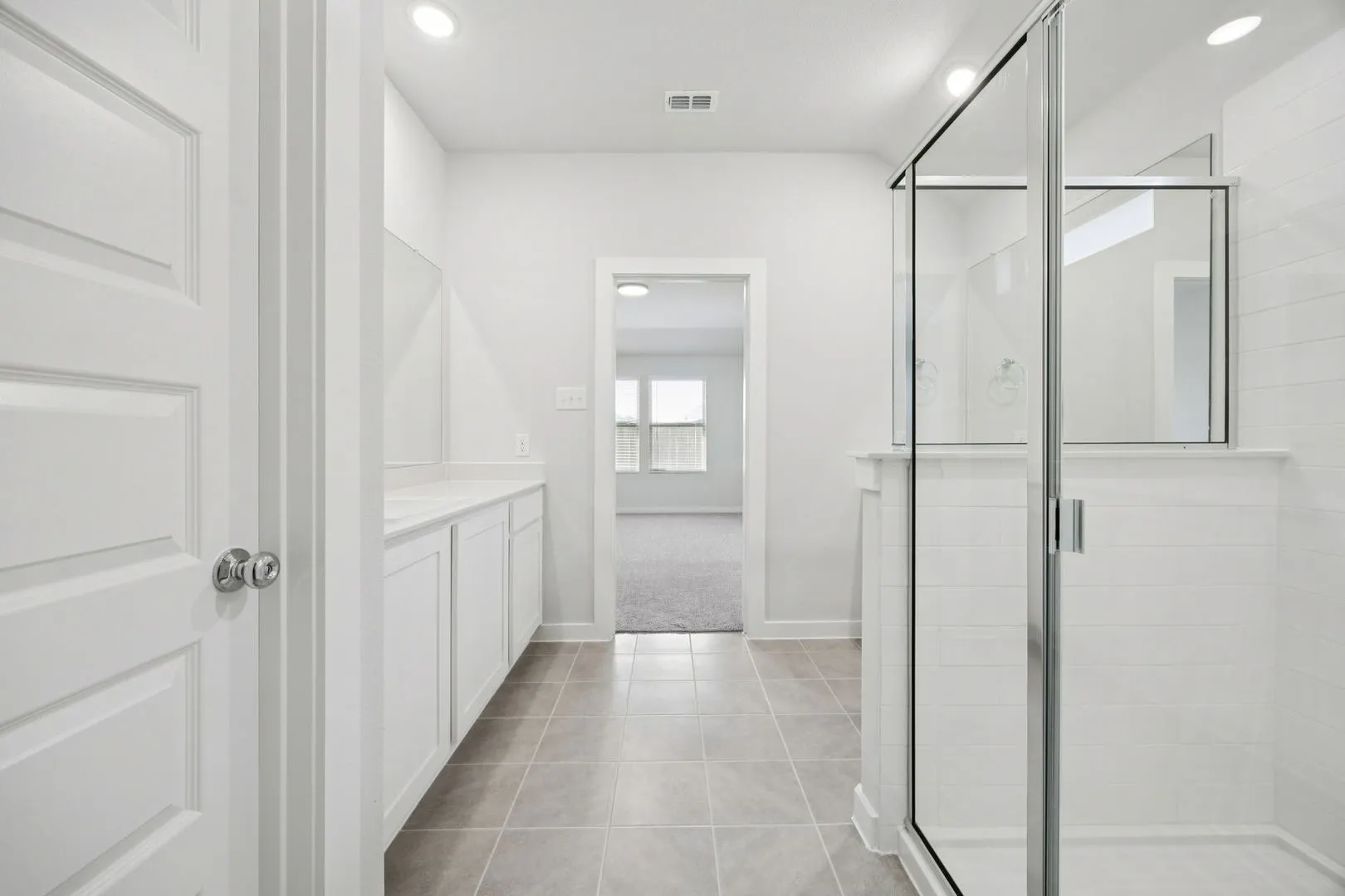 Primary Bathroom in the Heisman home plan by Trophy Signature Homes – REPRESENTATIVE PHOTO