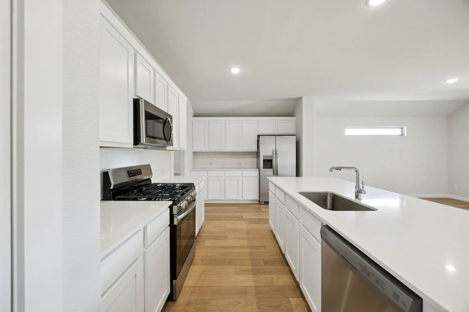 Kitchen in the Heisman home plan by Trophy Signature Homes – REPRESENTATIVE PHOTO