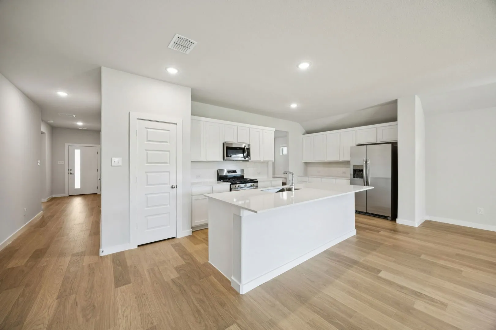 Kitchen in the Heisman home plan by Trophy Signature Homes – REPRESENTATIVE PHOTO