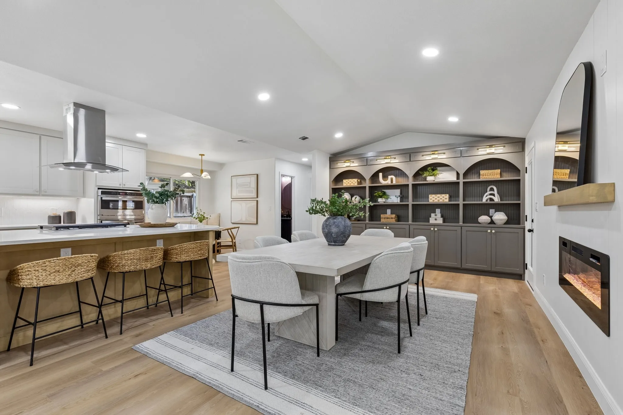 Open-concept living area with wood-finish flooring