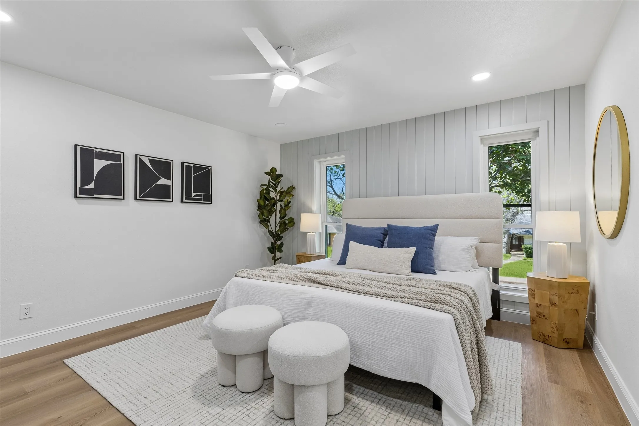 Wood-finish flooring, recessed lighting, and a ceiling fan