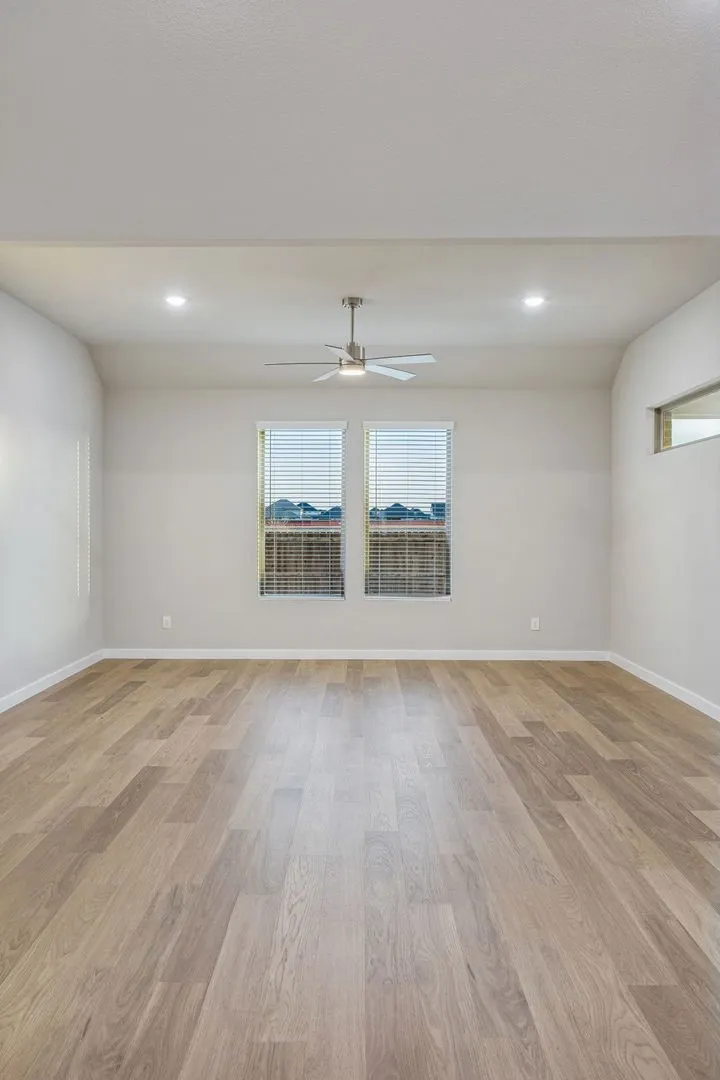 Living Room in the Wimbledon home plan by Trophy Signature Homes – REPRESENTATIVE PHOTO