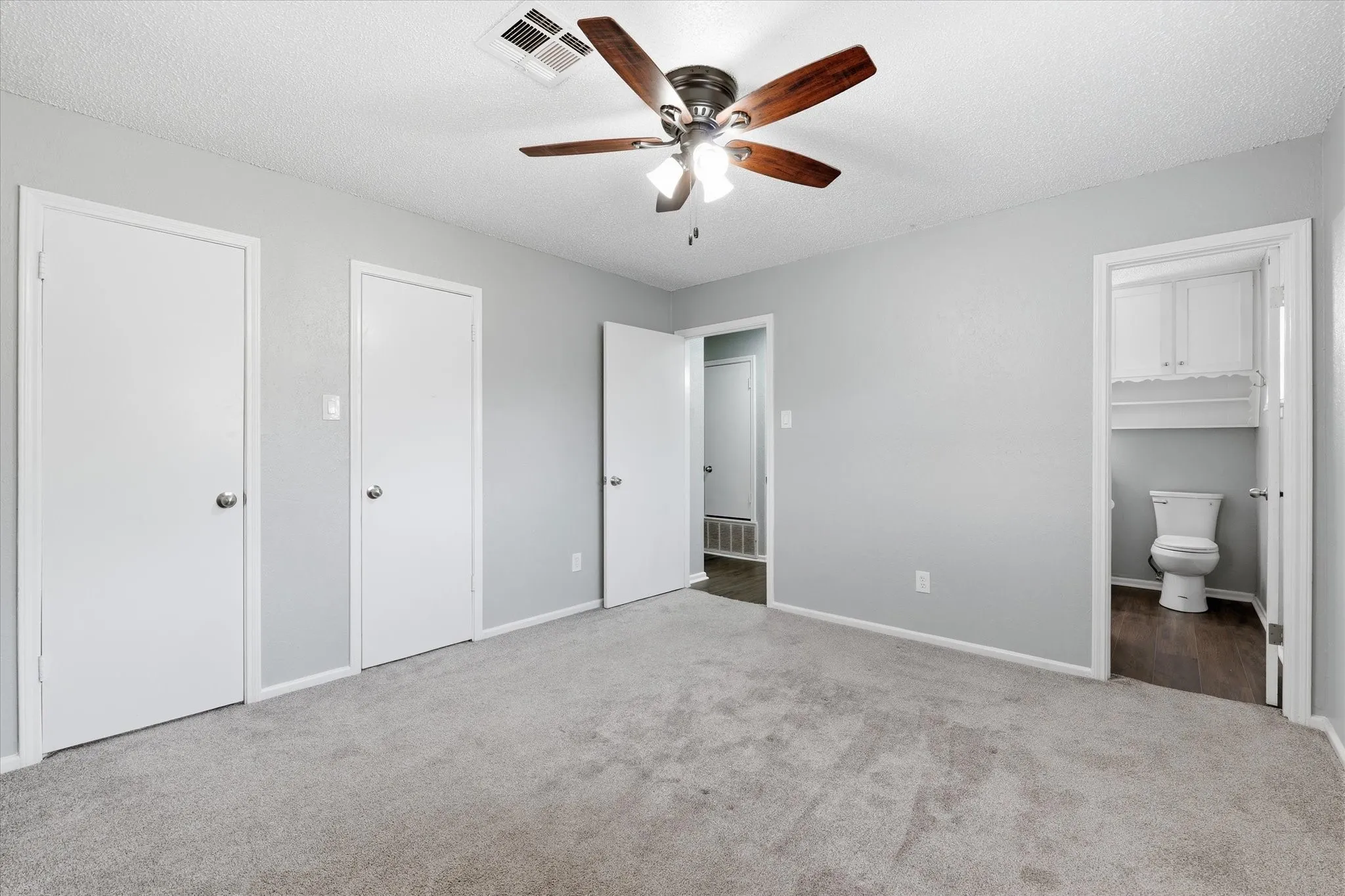 Plush gray carpeting with light gray walls