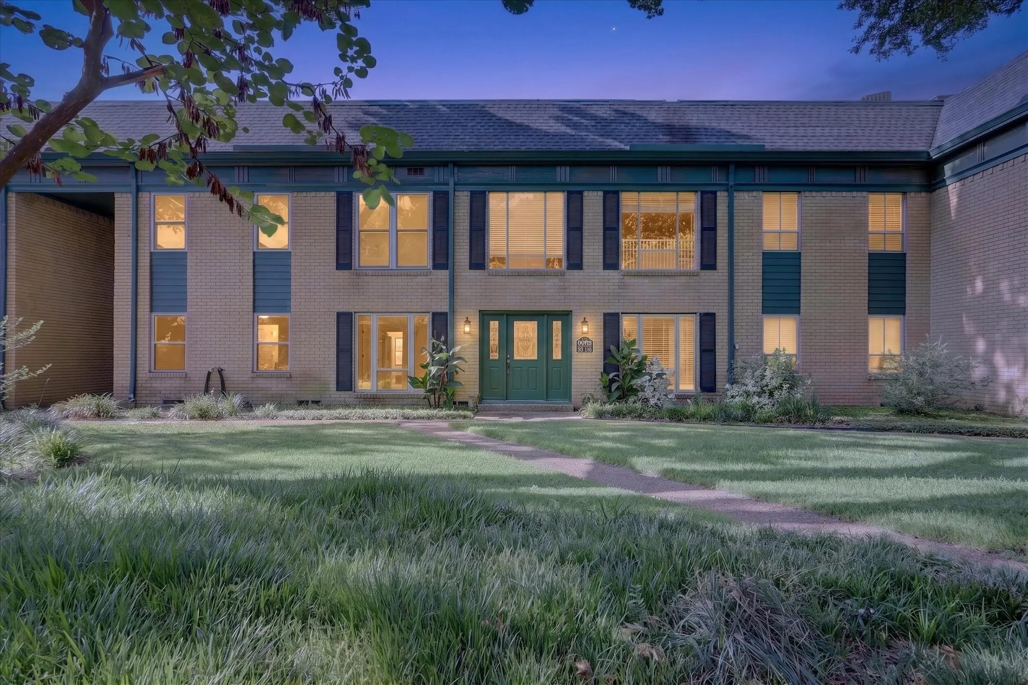 6020 E University Blvd Unit 117, Dallas TX 75206. Fully renovated gated condo community in East Dallas near SMU and Lower Greenville at twilight.