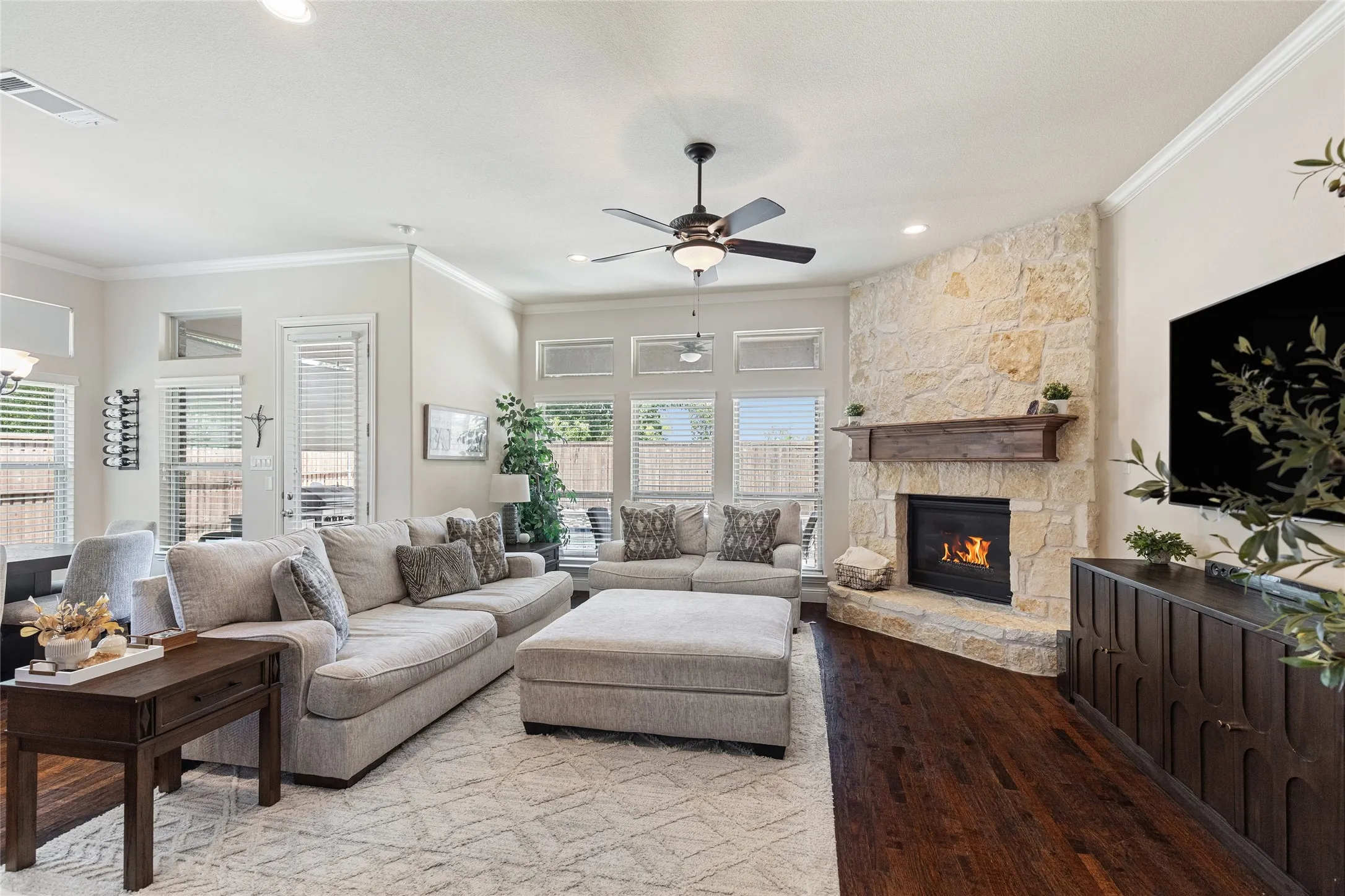 Open floor plan living room with view of pool and yard