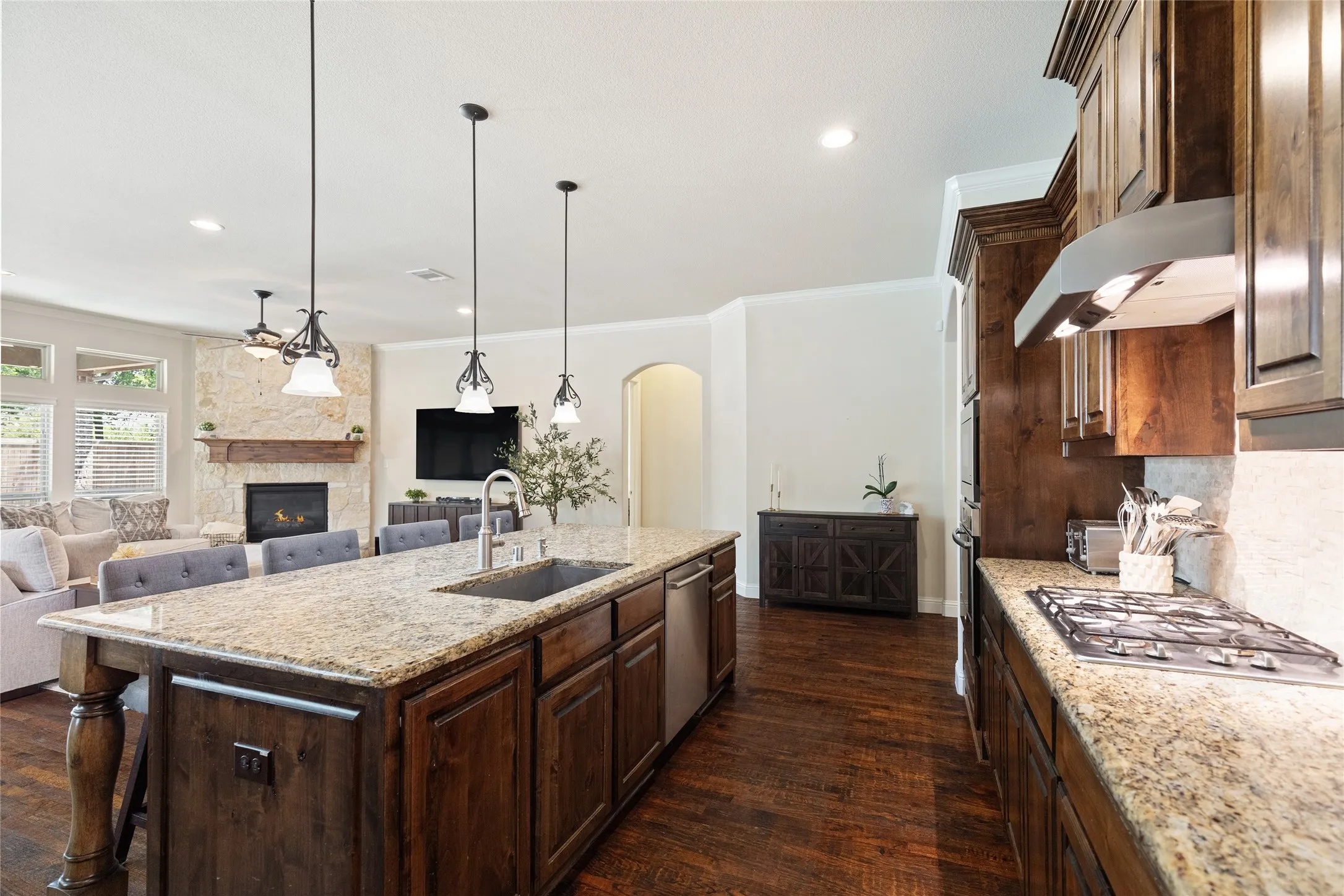 Kitchen with gas cooktop overlooking living room