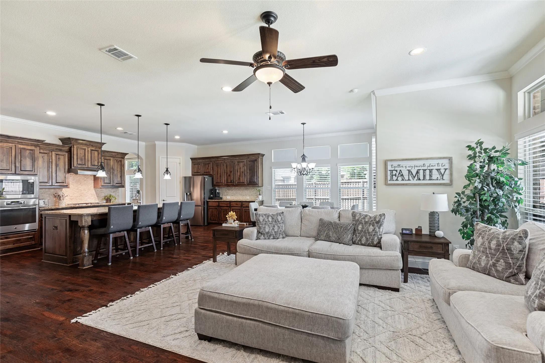 Open floor plan living room with view of pool and yard