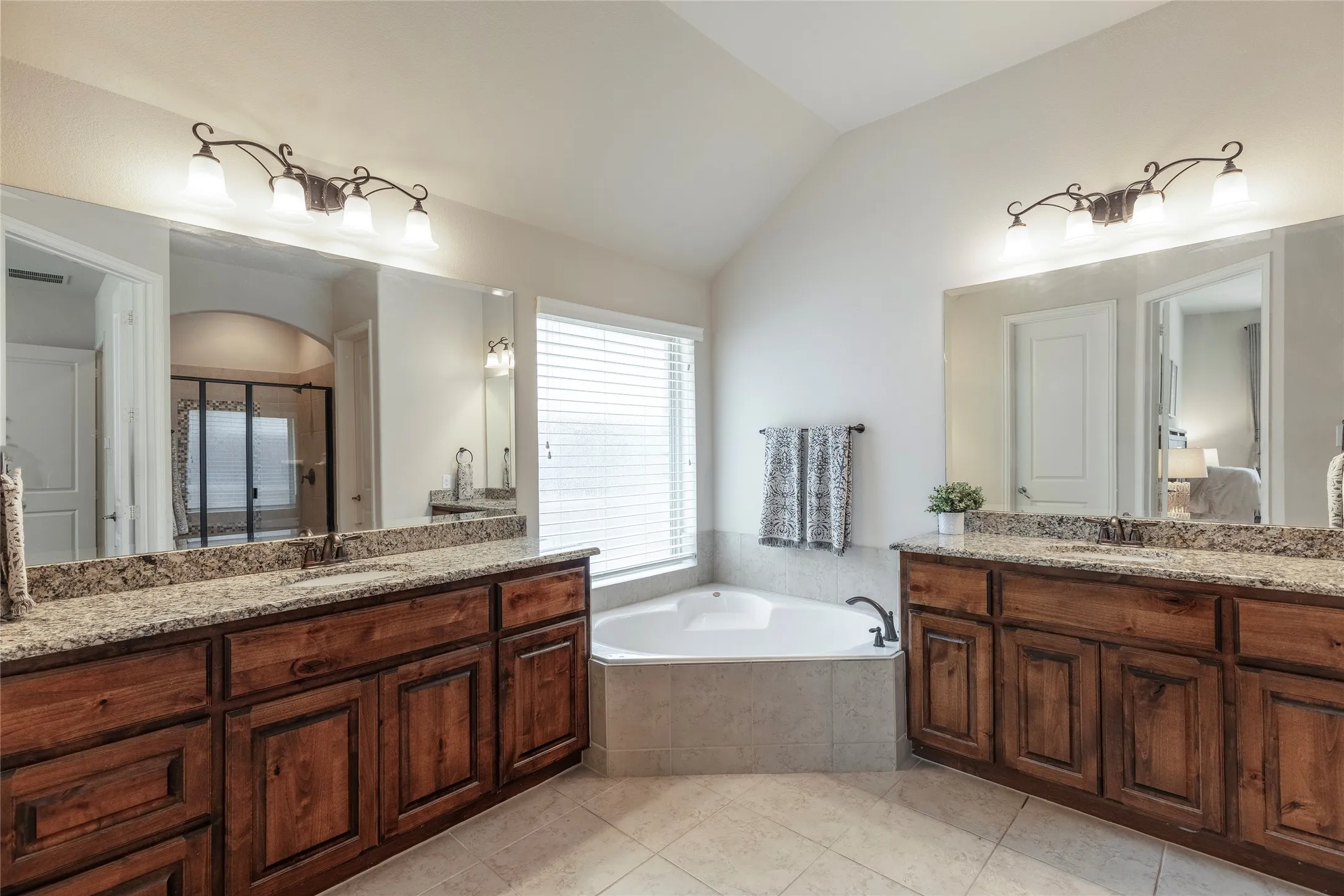 Primary bathroom with two vanities