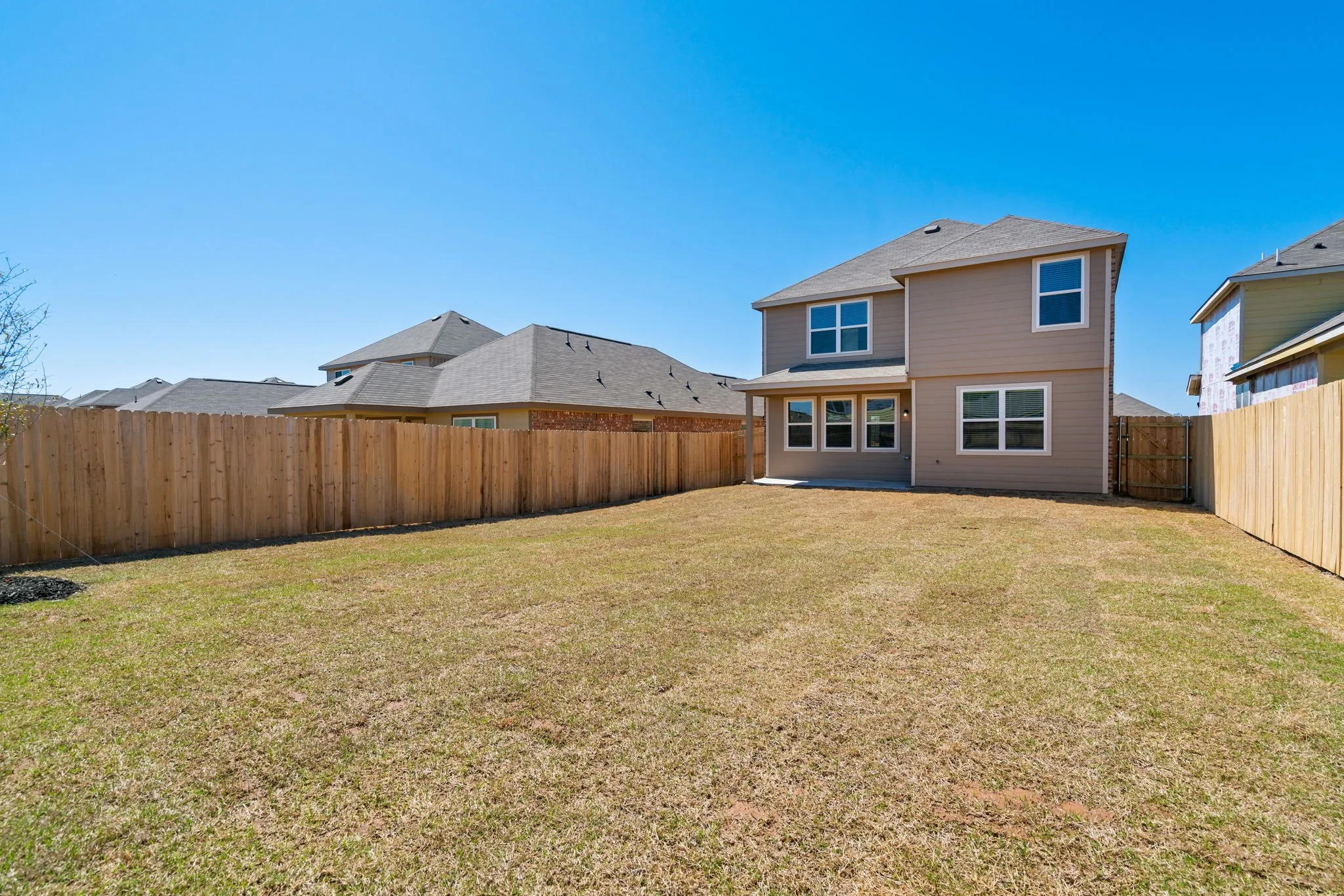 Large yard with covered patio
