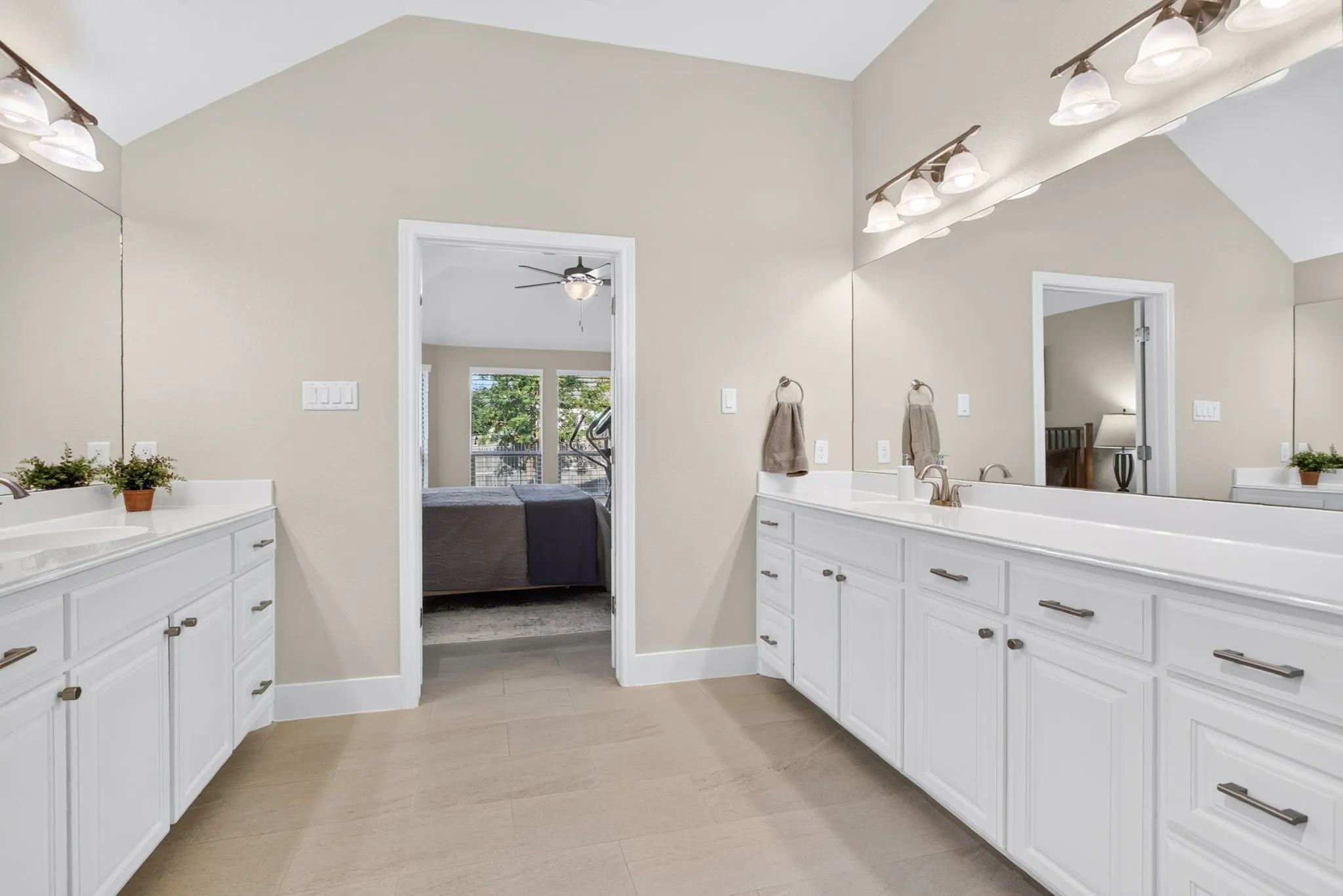Primary bathroom with separate vanities