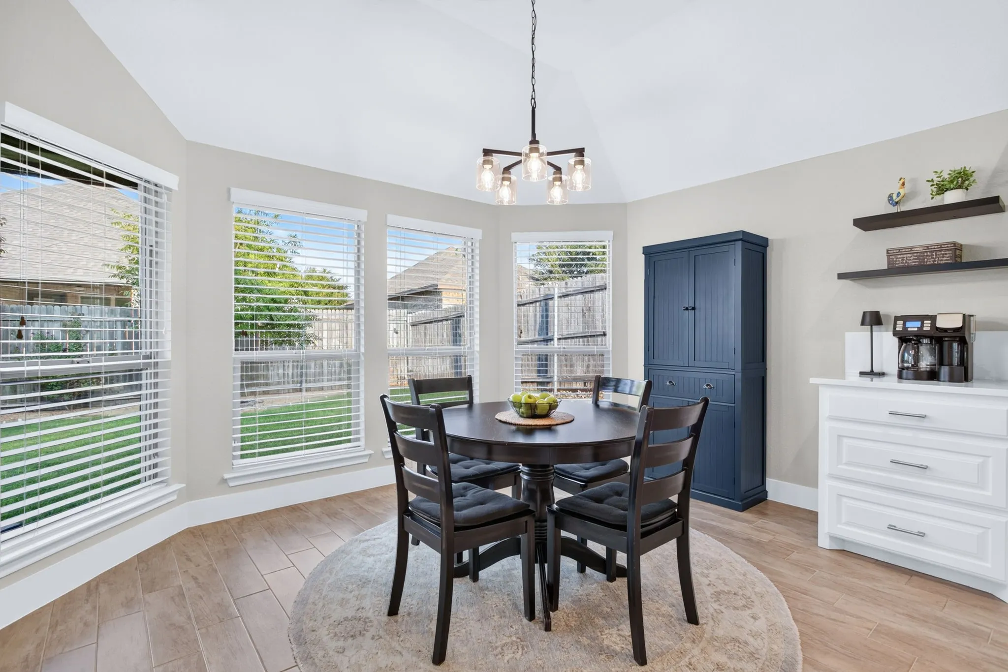 Breakfast nook nestled in the wall of windows