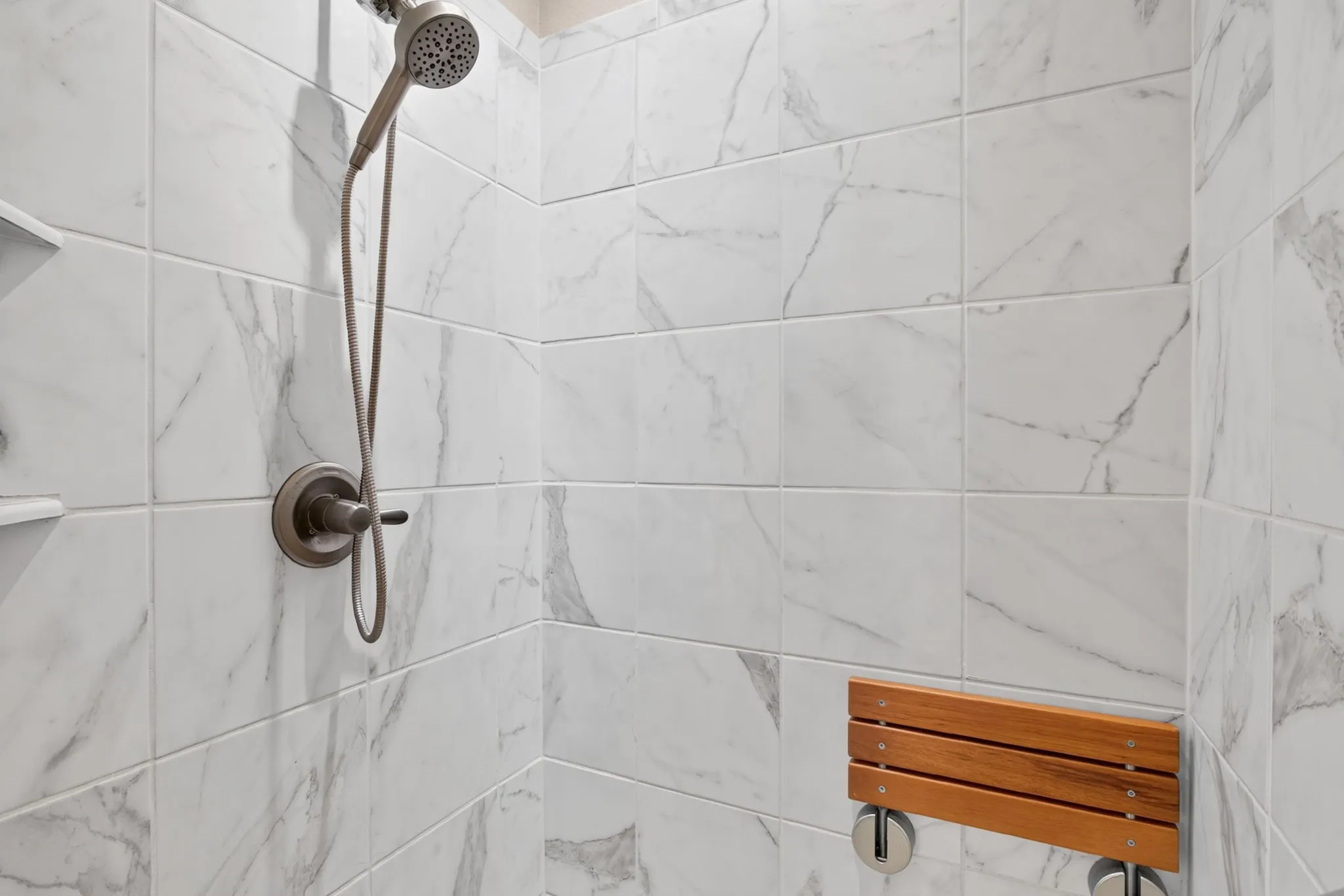 Recently added bench and bar in primary shower