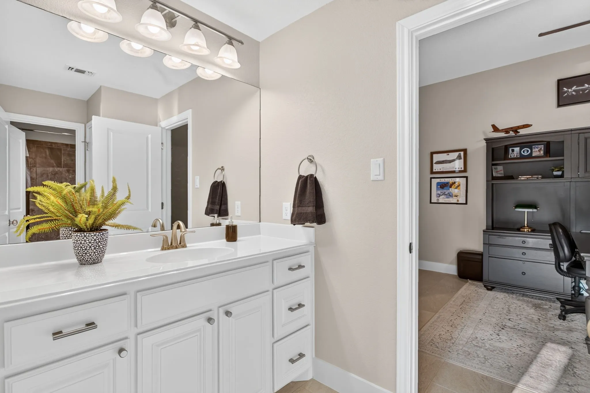 Jack and Jill bathroom with separate commode and bath/shower.