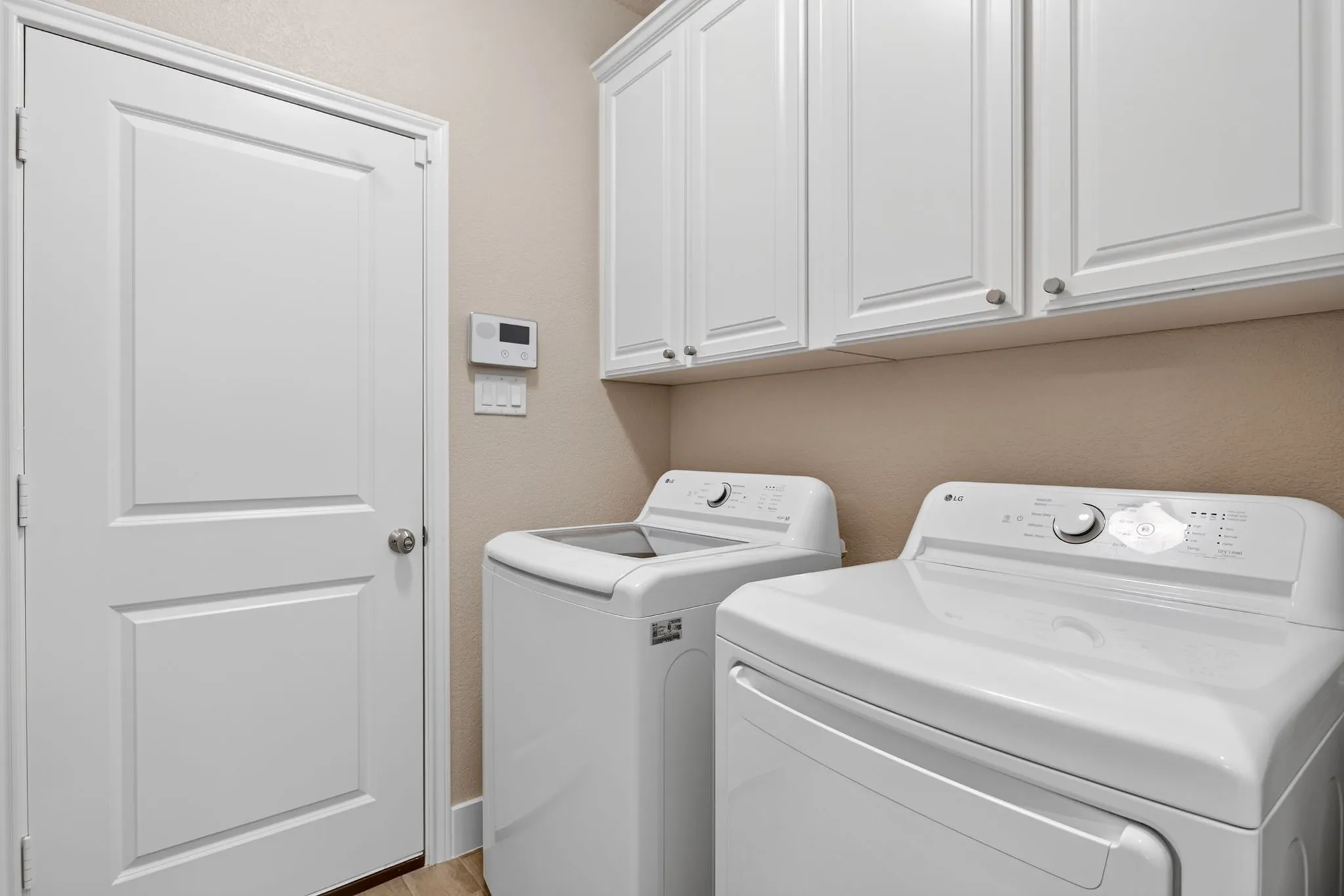 Laundry room can accommodate front or top loader washing machine