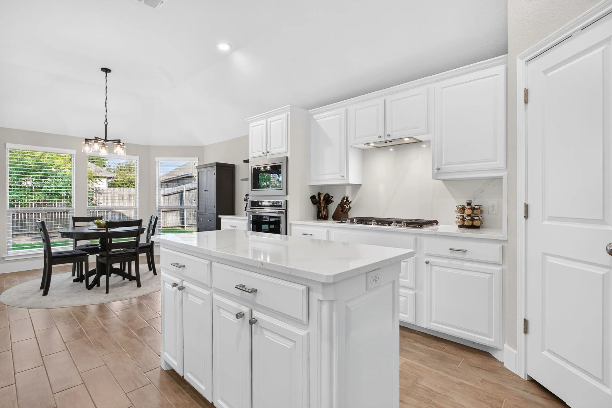 Kitchen has an island and large pantry