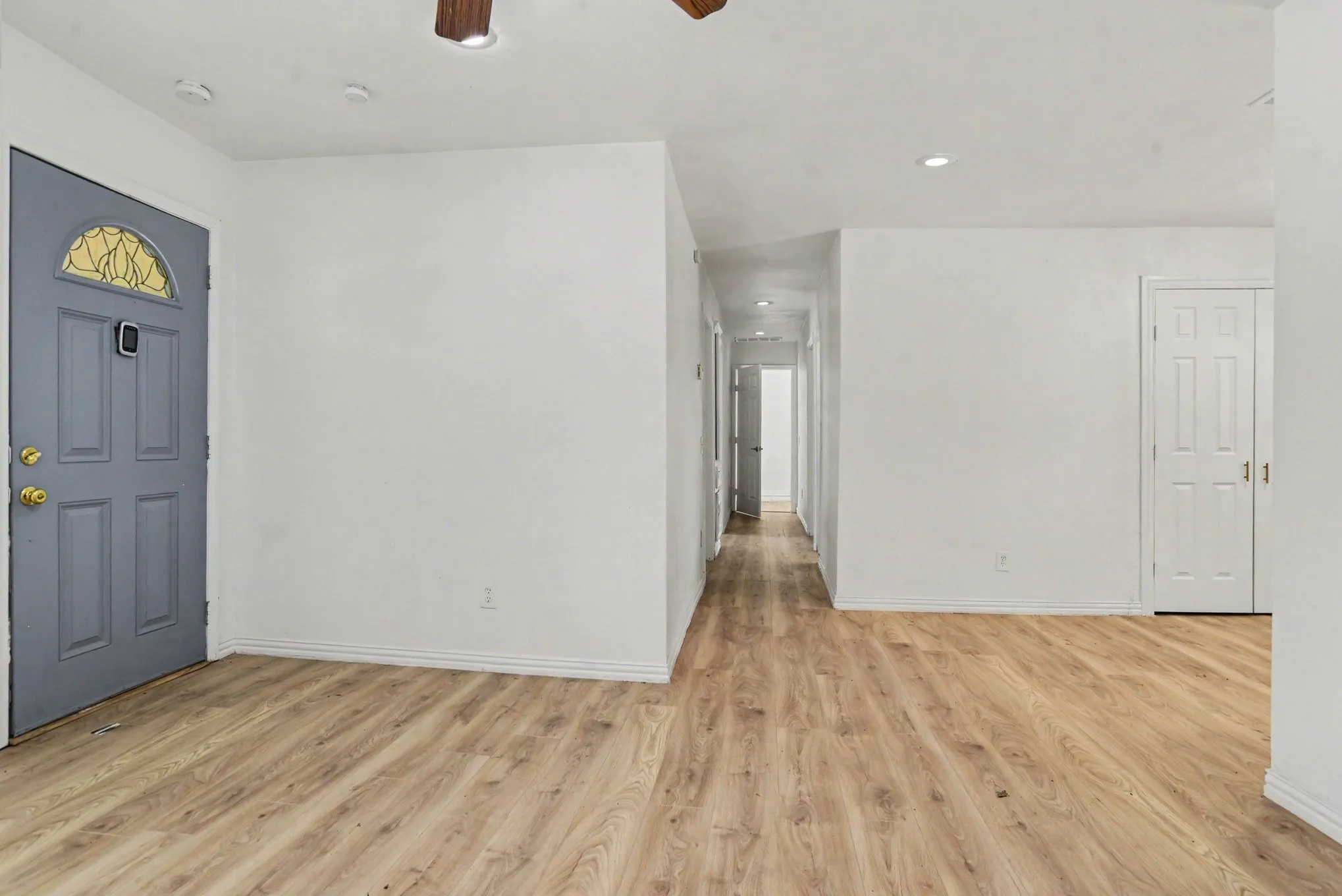 Entryway view looking into the open main floor plan with easy access to adjoining rooms.