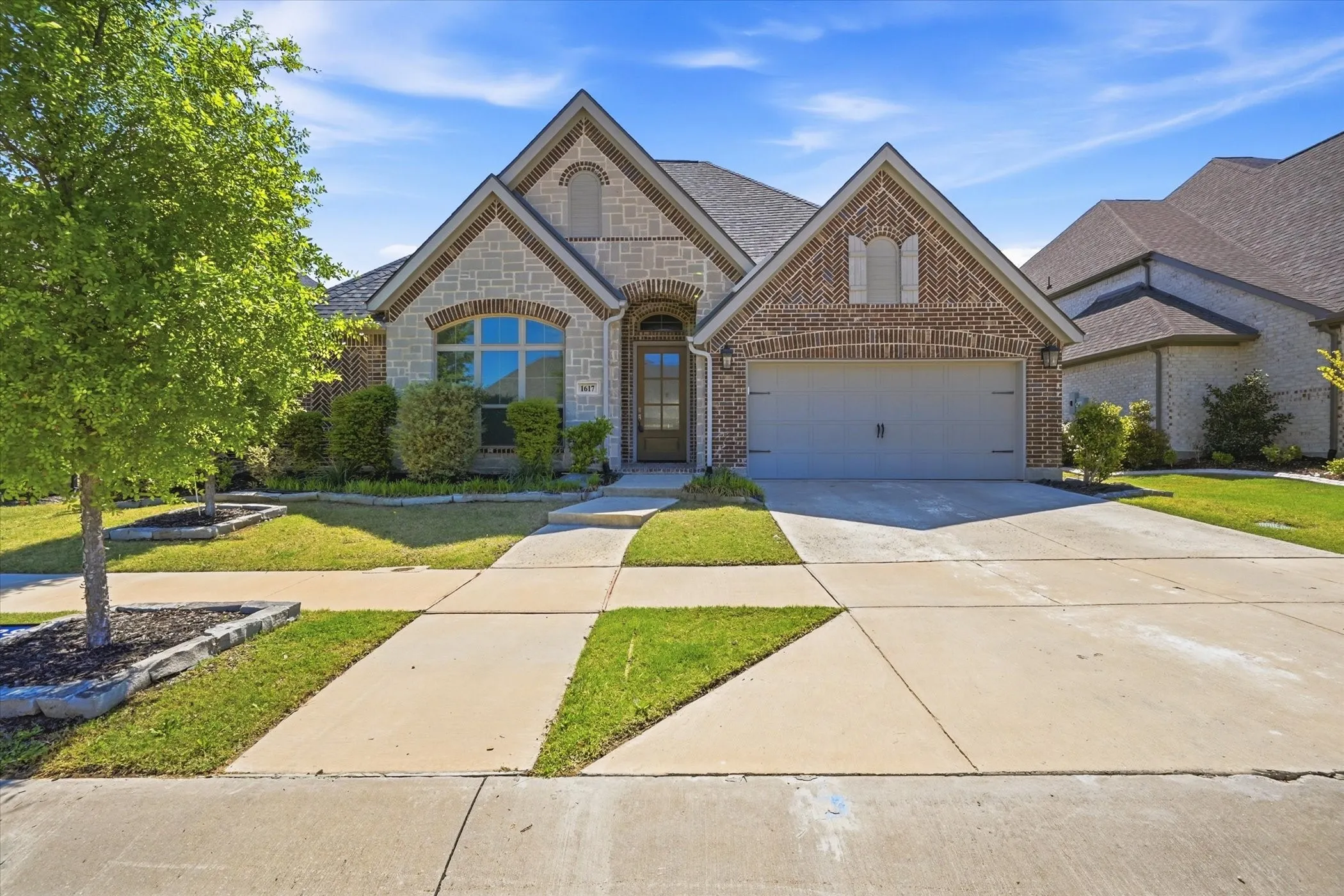 Brick and stone exterior with a gabled roofline