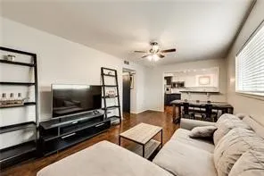Recessed lighting, wood-finish flooring, ceiling fan, and window with blinds