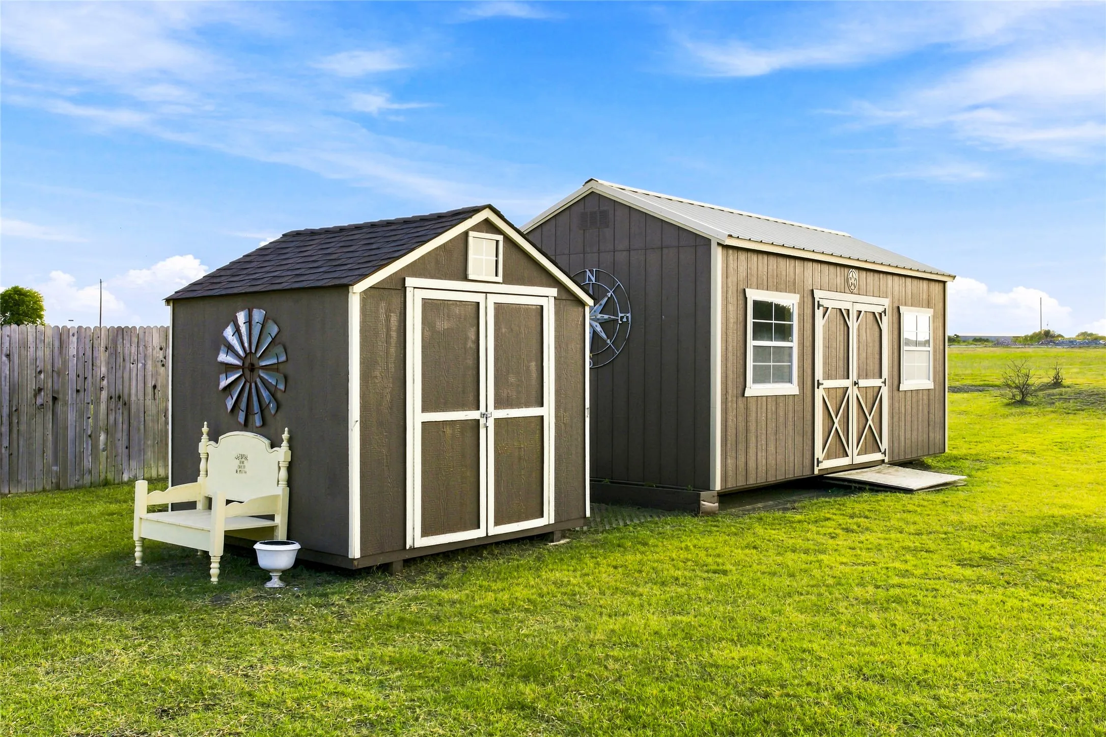 Two outdoor buildings are in the back yard on the left side.  These are used for storage now and they will remain with the property.