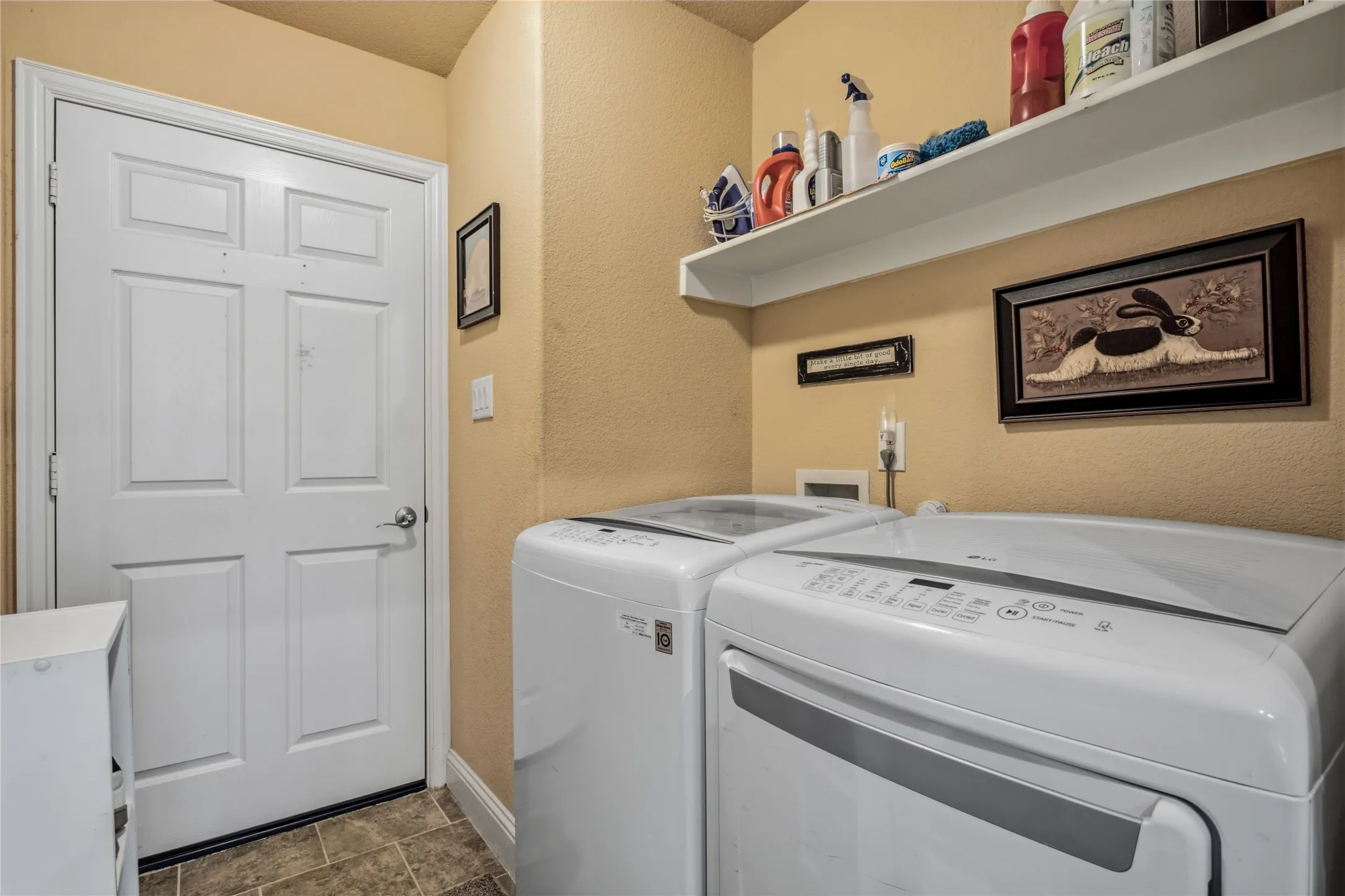 The laundry room is between the kitchen and the garage.