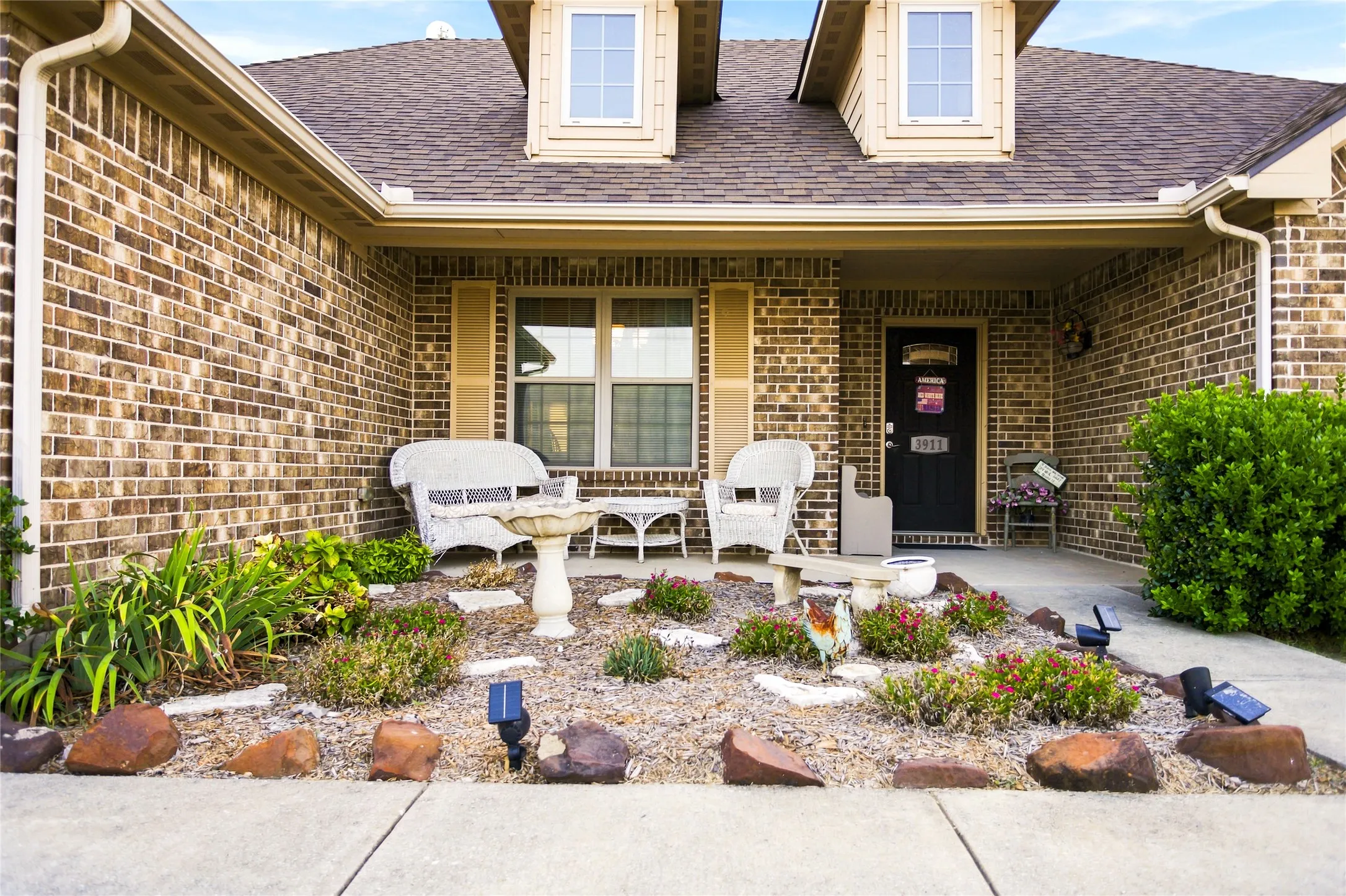 The front entry is a whimsical porch where you can enjoy the view of an open field...  birds singing and open space!