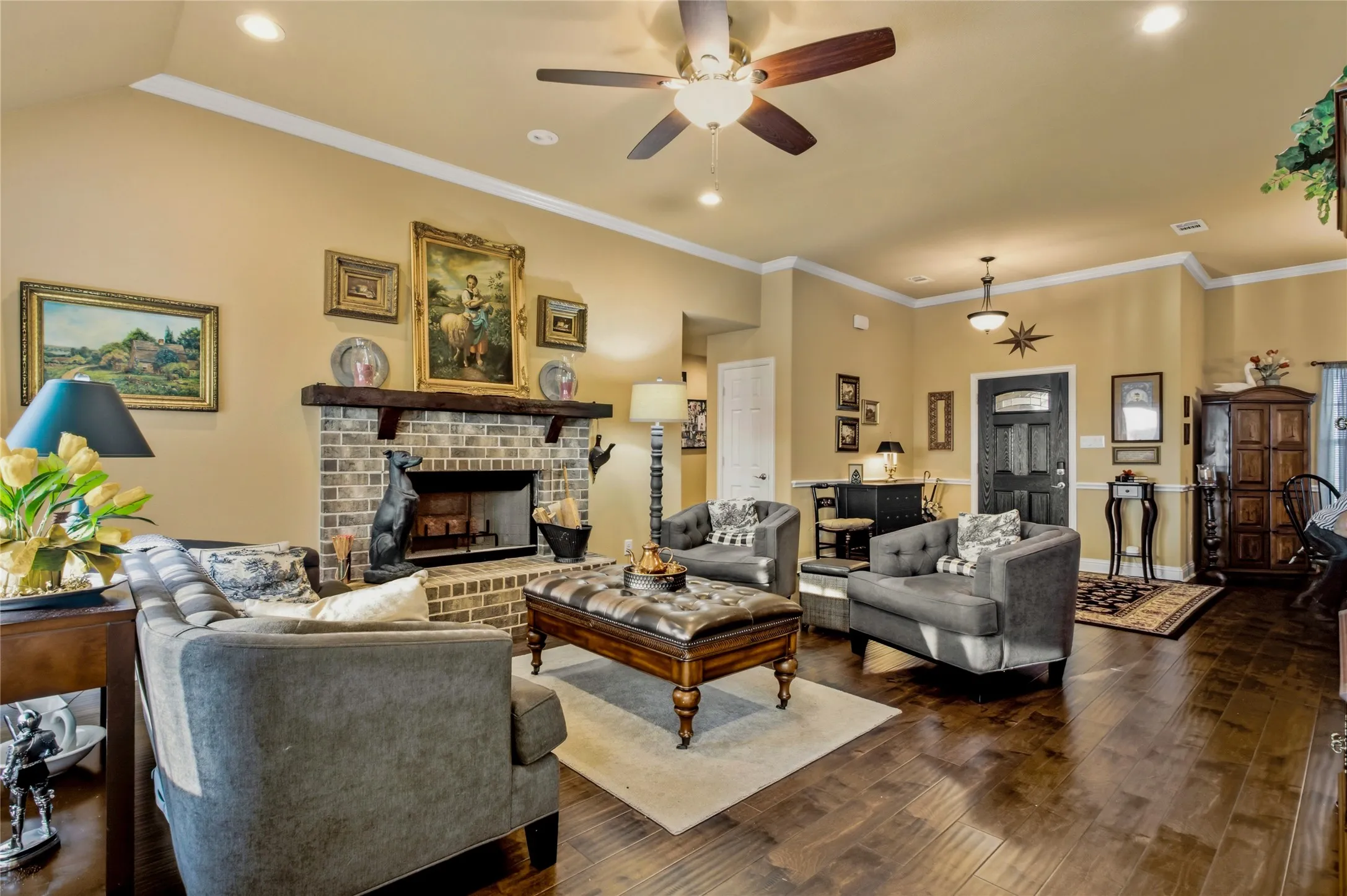 Comfortable living is just steps away as you enter the front door into a lovely living area featuring high ceilings and a fireplace.