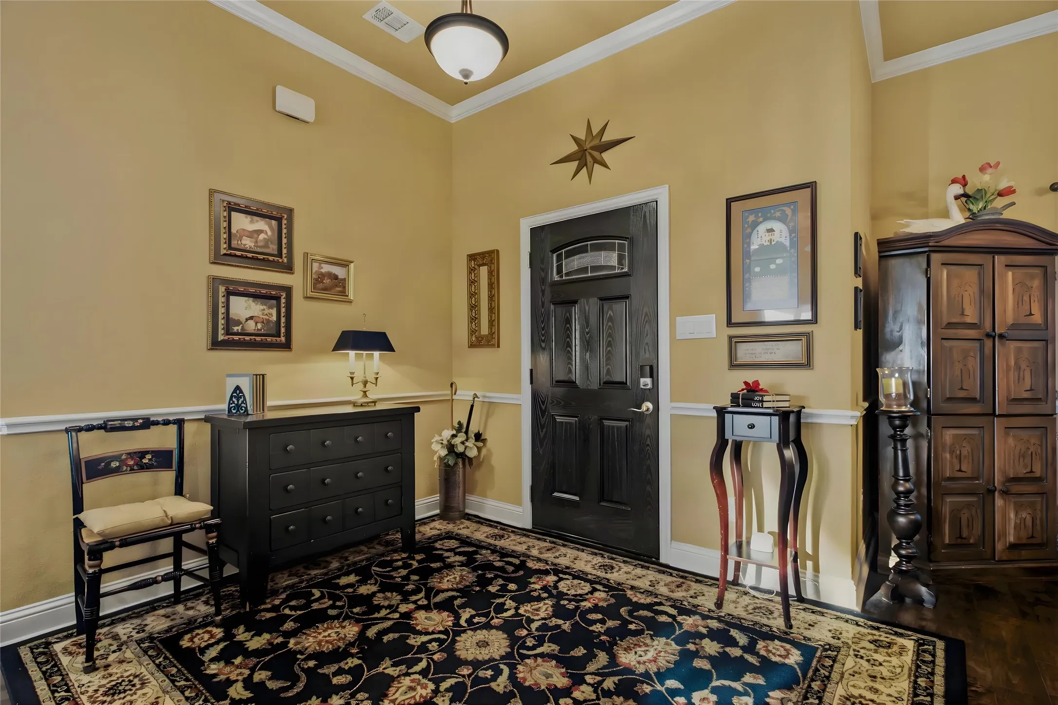 The front entry has a nice warmth with the neutral wall color and an open feel.