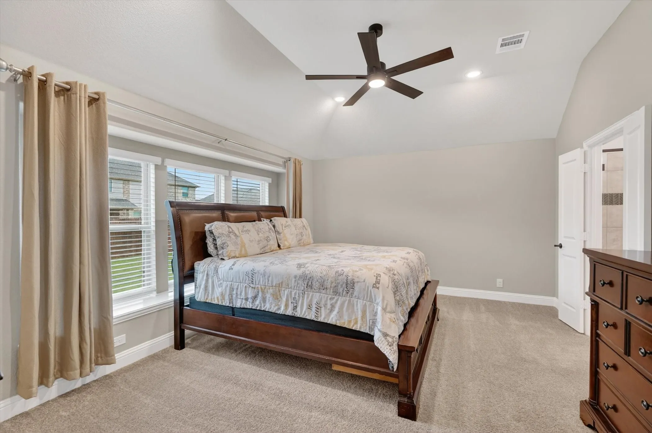 Vaulted ceiling featuring a ceiling fan with integrated lighting